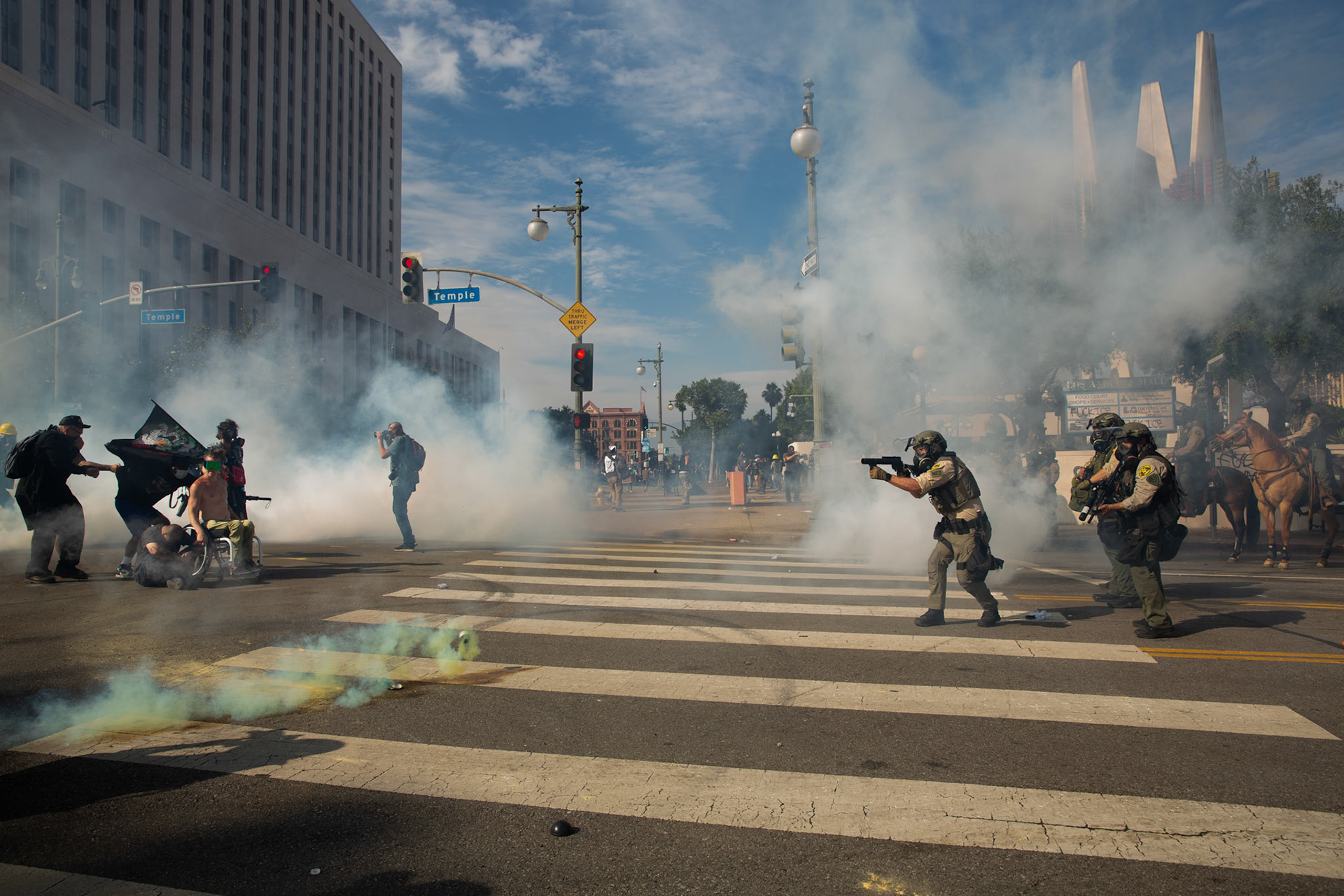 Los Angeles County Shriffs fires tear gas and flash bang grenades at peaceful demonstrators during a march against the Trump Military Parade and immigration raids by ICE in Downtown Los Angeles on June 13, 2025