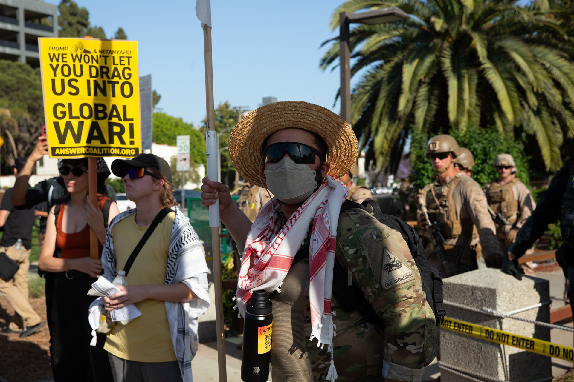 An Army First Armor Division veteran who goes by Tucker after speaking to protestors while United States Marines guard the Federal Building on Wilshire Boulevard in Los Angeles Calif. on June 18, 2025 during a demonstration against U.S. involvement in the war between Israel and Iran. During an interview Tucker recounts seeing the negative impact warfare has on society and the environment during his last deployment. He says his experiene in service made him realize that military intervention has not made the world a safer place urges service members to reach out to The GI Rights Hotline for assistane if they want help becoming conscious objectors.