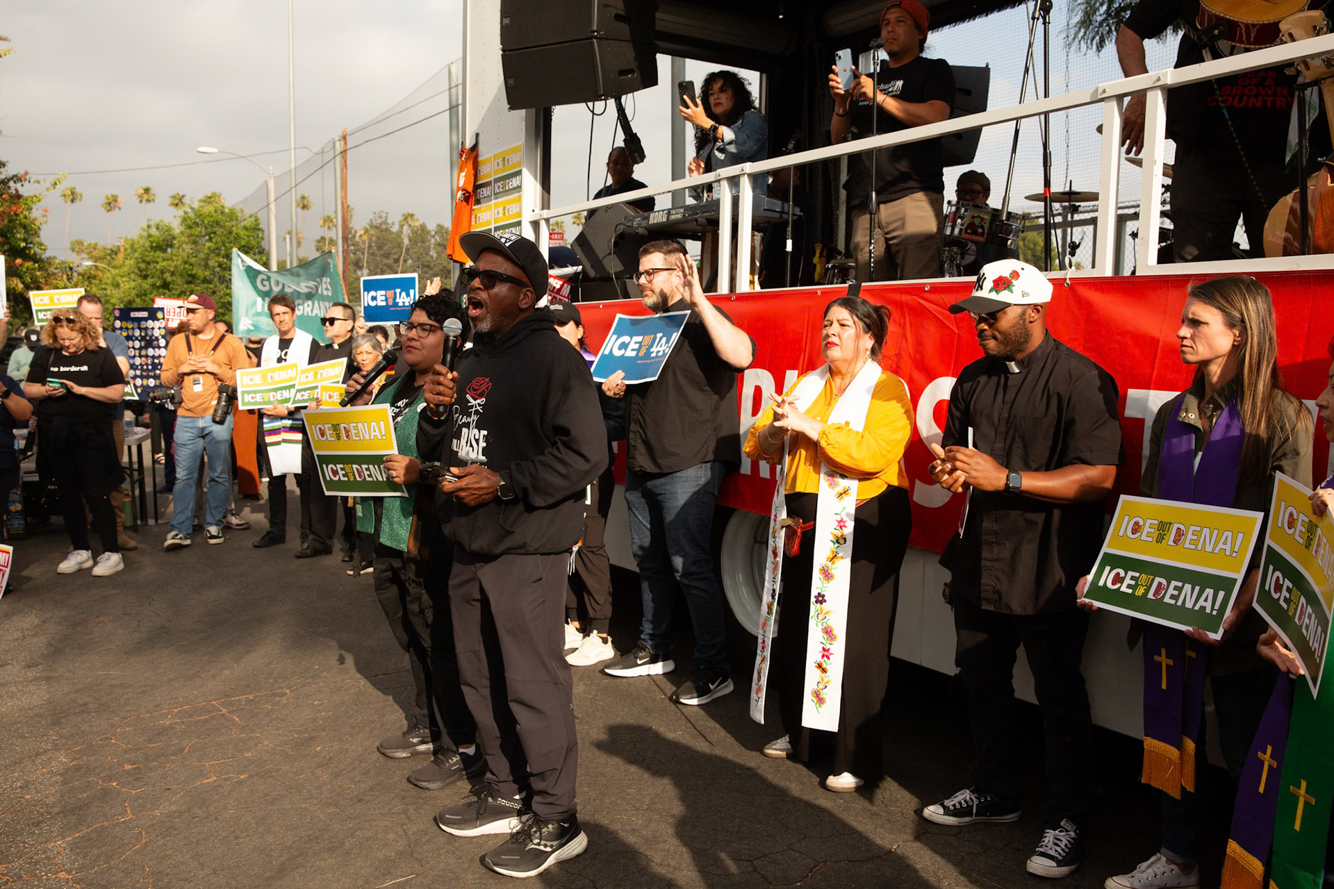 Pastor Kerwin Manning leads a player during a vigil held in honor of residents abducted by ICE in Pasadena, Calif. on June 21, 2025.
