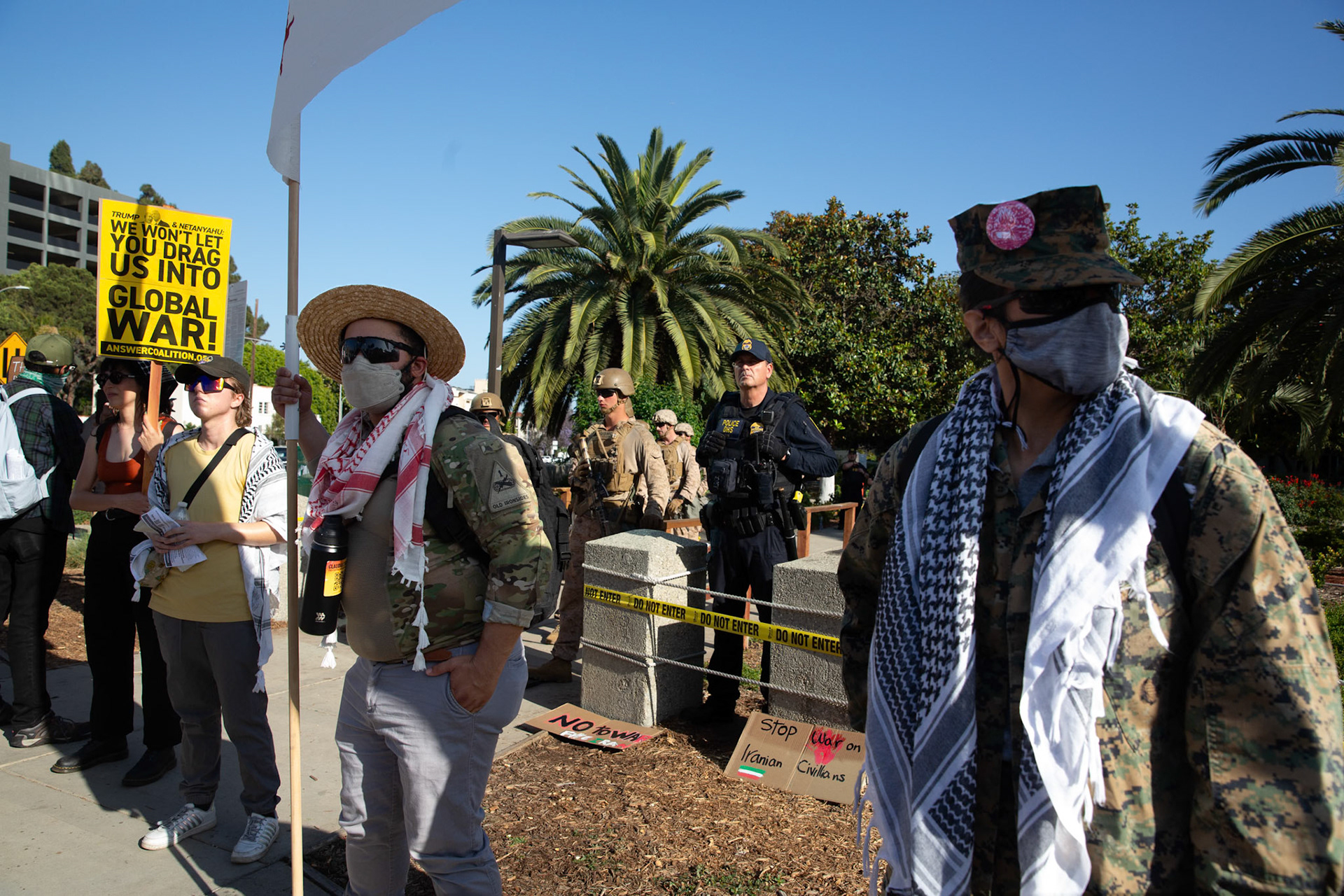 An Army First Armor Division veteran who goes by Tucker after speaking to protestors while United States Marines guard the Federal Building on Wilshire Boulevard in Los Angeles Calif. on June 18, 2025 during a demonstration against U.S. involvement in the war between Israel and Iran. During an interview Tucker recounts seeing the negative impact warfare has on society and the environment during his last deployment. He says his experiene in service made him realize that military intervention has not made the world a safer place urges service members to reach out to The GI Rights Hotline for assistane if they want help becoming conscious objectors.