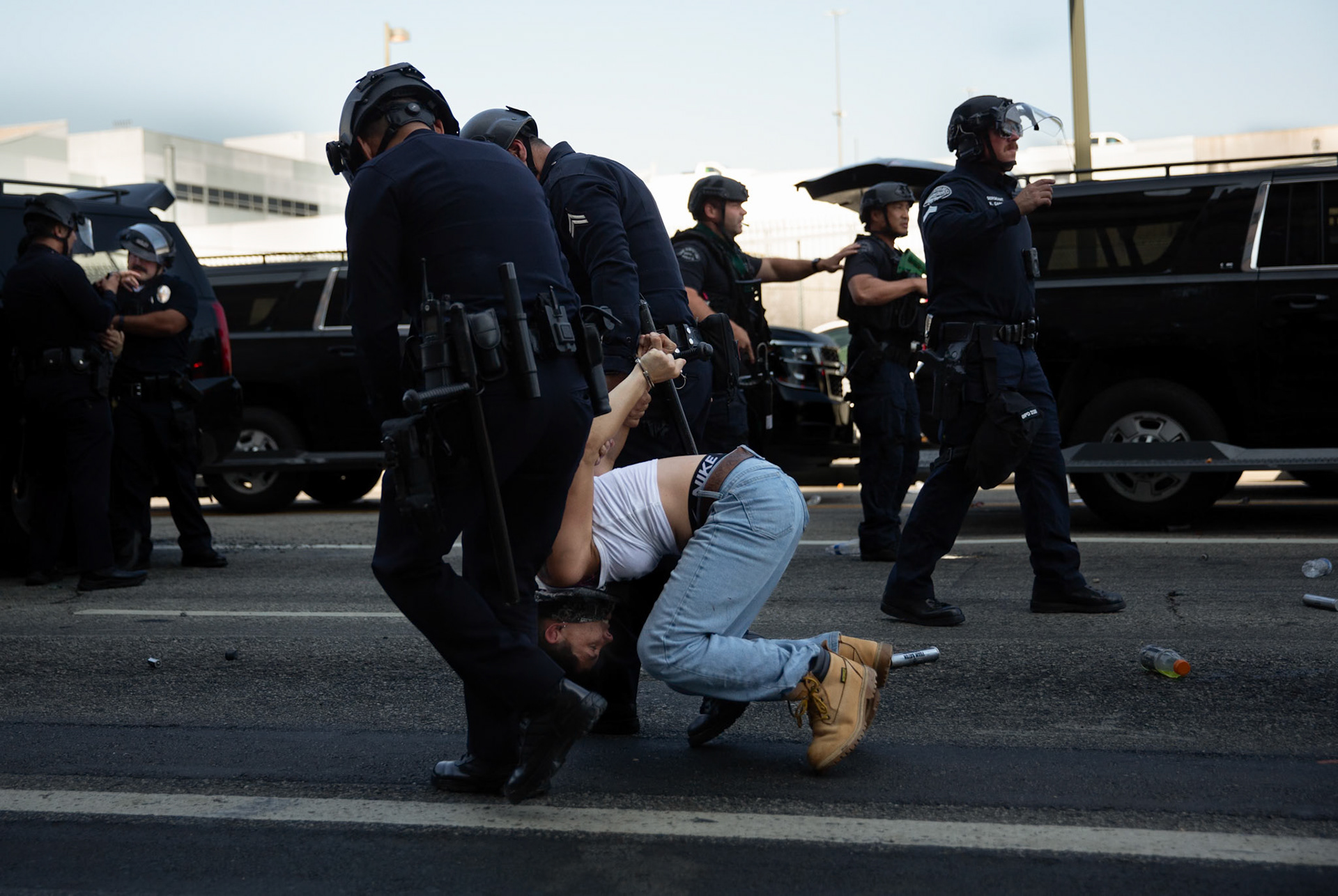 LAPD officers arrest a demonstrator in front of the Metropolitan Detention Center in Donwtown Los Angeles, Calif. on June 8, 2025 during a protest against immigration raids conducted by ICE and Federal police.