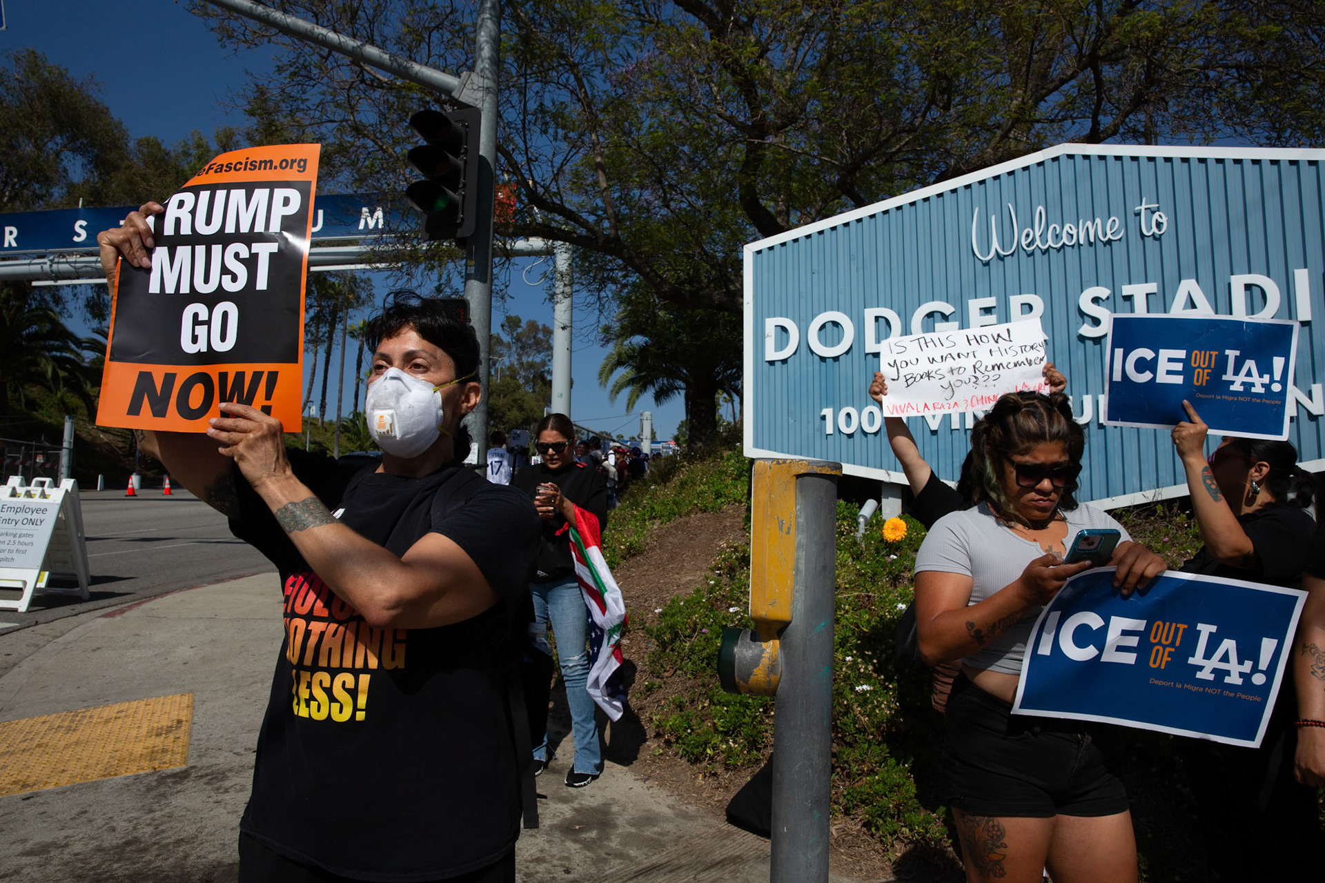 Demonstrator gather at the Dodger Stadium in Angeles, Calif. on June 19, 2025 while fans queue up to watch the baseball game between the Los Angeles Dodgers and San Diego Padres to protest the presence of ICE and Border Patrol agents at the stadium parking lot earlier in the day. A statement from Dodgers Team News website during the stand off states that the Dodgers has denied ICE agents access to the stadium.