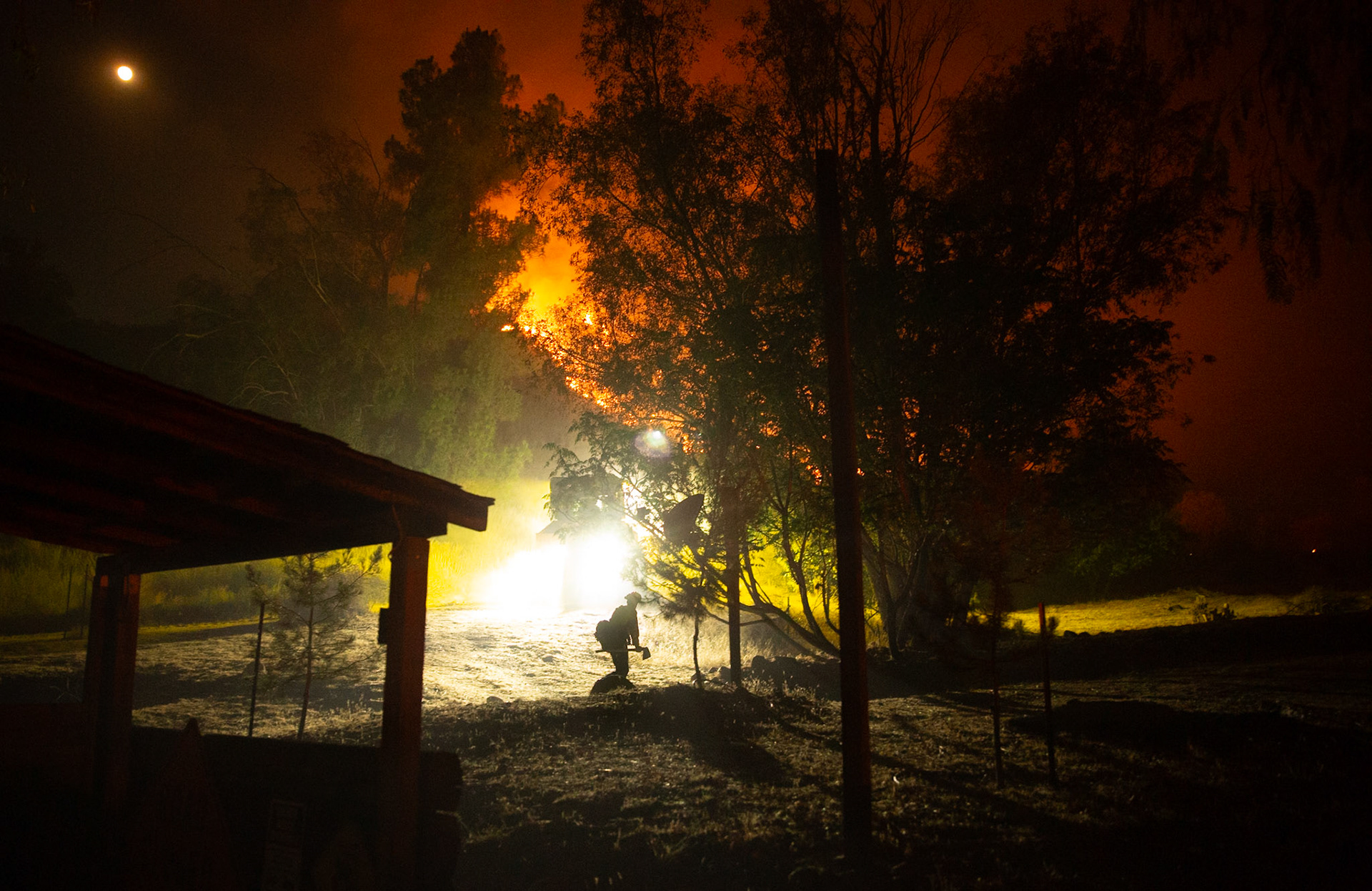 Firefighters use bulldozers and hand tools to remove vegetation in order prevent the wildfire from reaching nearby homes. The Canyon Fire started around 1:30pm on August 7, 2025 and rapidly spread to 600 acres in less than two hours. Aided by the heatwave in Southern California that reached 100 degrees Ferehnehit, dry vegetation, and steep topology; the fire has scorched more than 4,800 acres as of Thursday night.