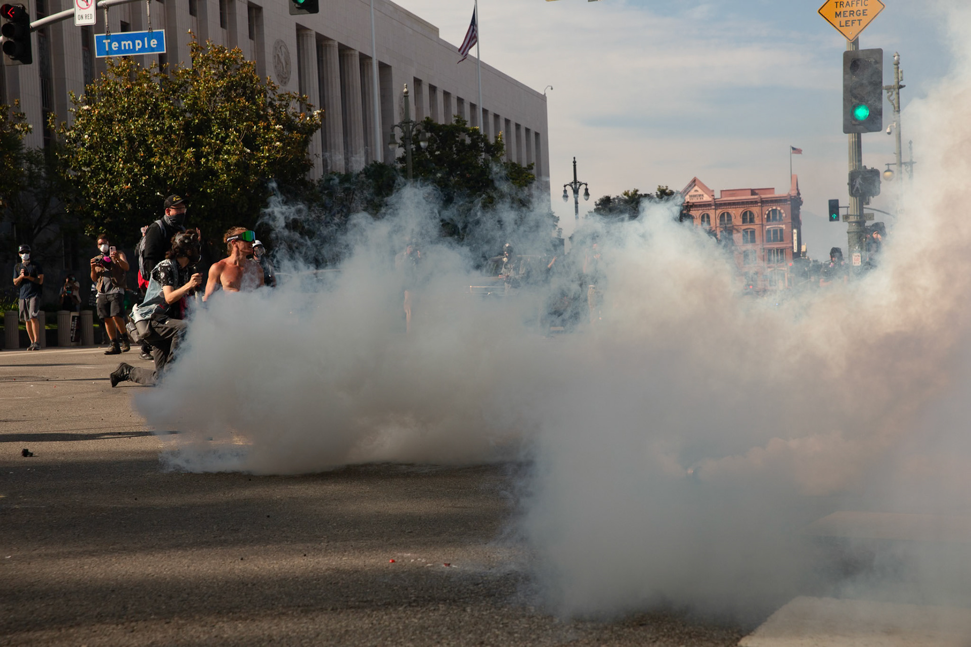 Los Angeles County Shriffs fires tear gas and flash bang grenades at peaceful demonstrators in a wheel chair during a march against the Trump Military Parade and immigration raids by ICE in Downtown Los Angeles on June 13, 2025