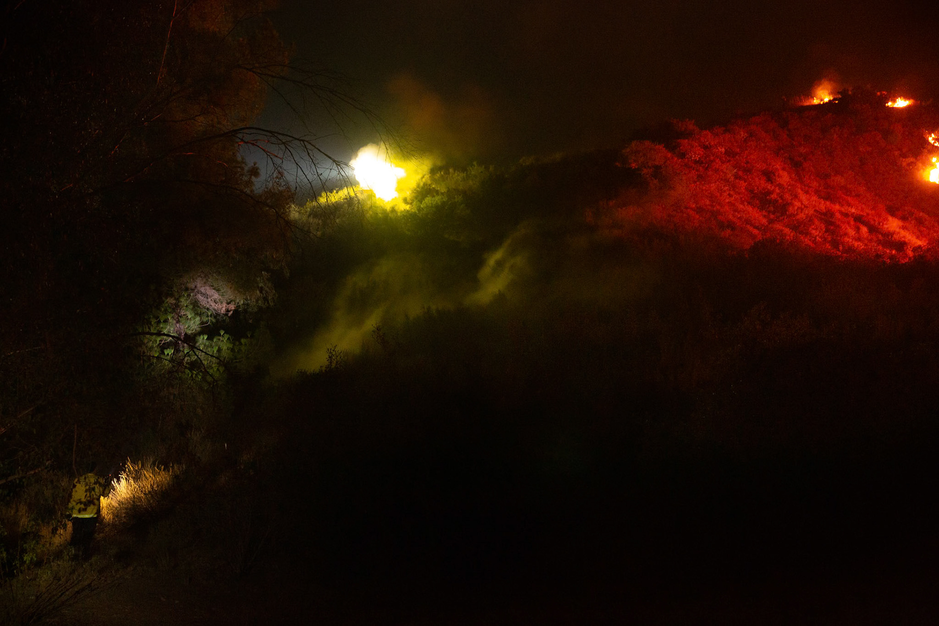 Firefighters use bulldozers and hand tools to remove vegetation in order prevent the wildfire from reaching nearby homes. The Canyon Fire started around 1:30pm on August 7, 2025 and rapidly spread to 600 acres in less than two hours. Aided by the heatwave in Southern California that reached 100 degrees Ferehnehit, dry vegetation, and steep topology; the fire has scorched more than 4,800 acres as of Thursday night.
