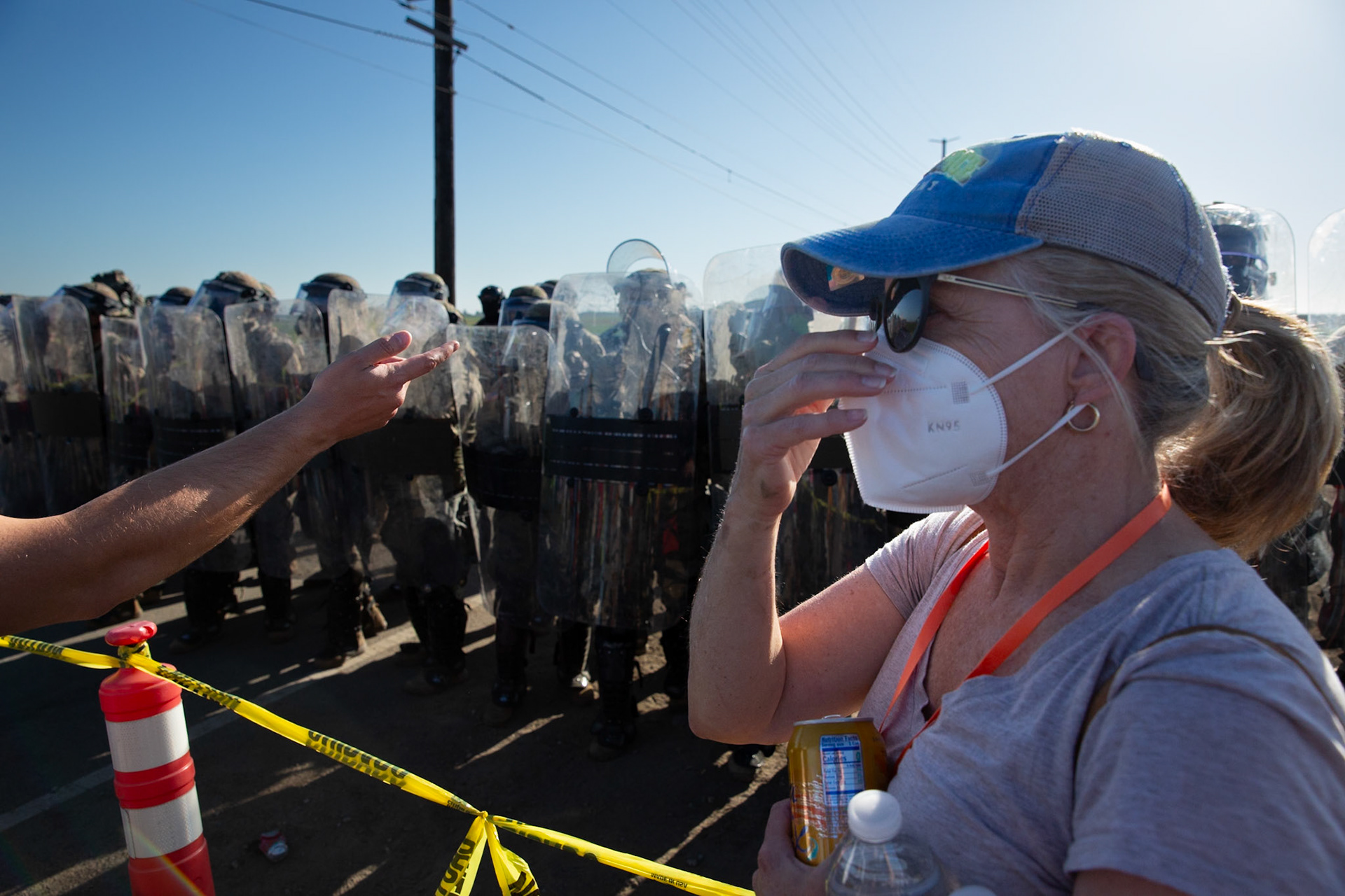 National Guards taped over the identifying logo on their shields at a farm. DHS agents from multiple subsidiaries conducts a mass raid at a farm in Camarillo, Calif. on July 10, 2025.