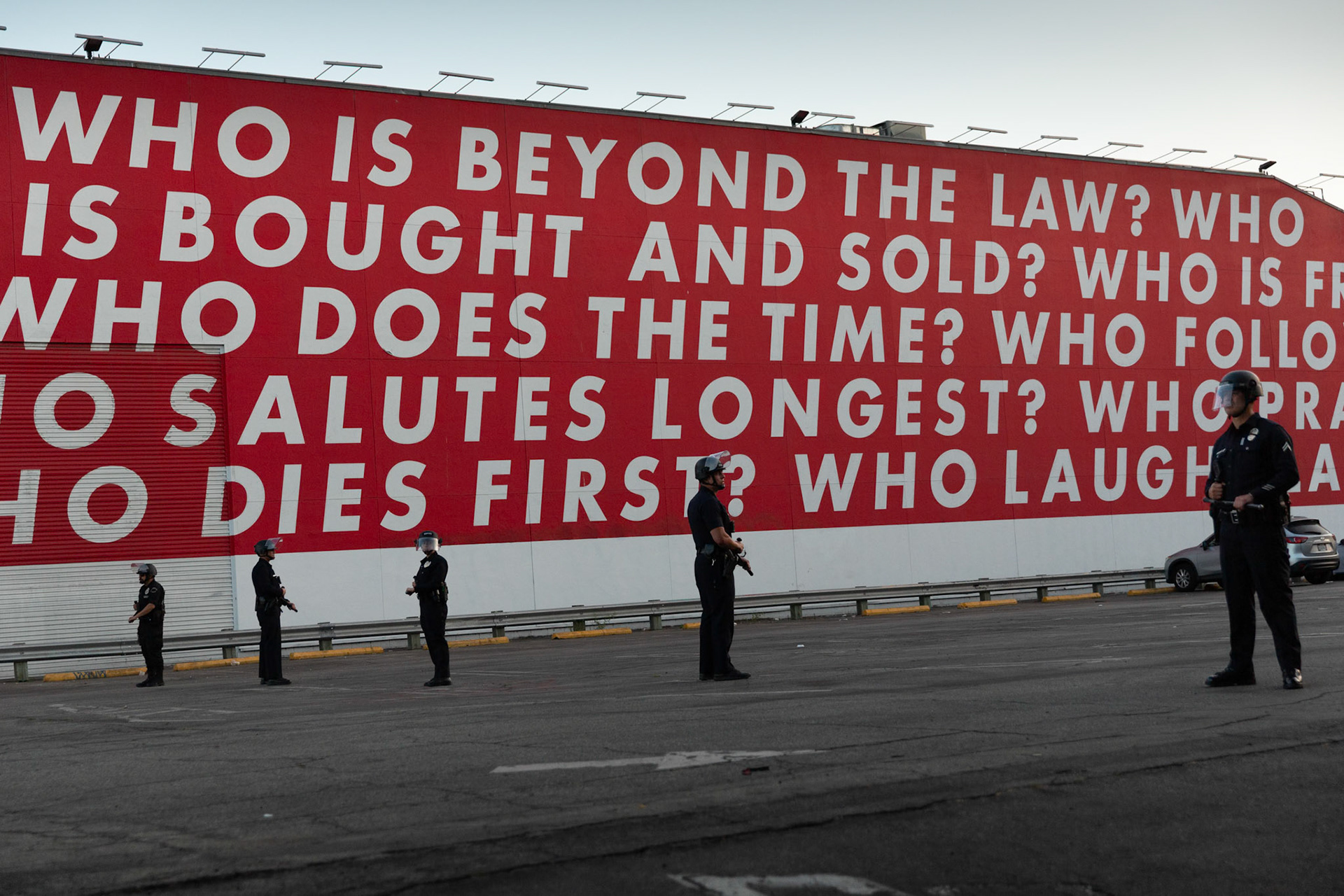 LAPD officers stand in the parking lot of the Museum of Contemporary Art in Downtown Los Angeles on June 13, 2025 during a demonstration against immigration raids by ICE.