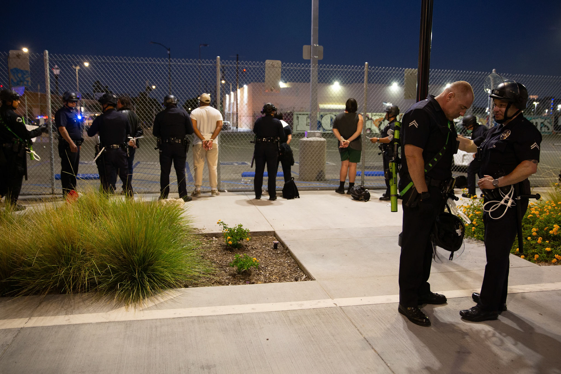 LAPD officers arrest demonstrators who did not leave the curfew zone after 8pm on June 13, 2025 in Downtown Los Angeles on June 13, 2025 after a demonstration against immigration raids by ICE.