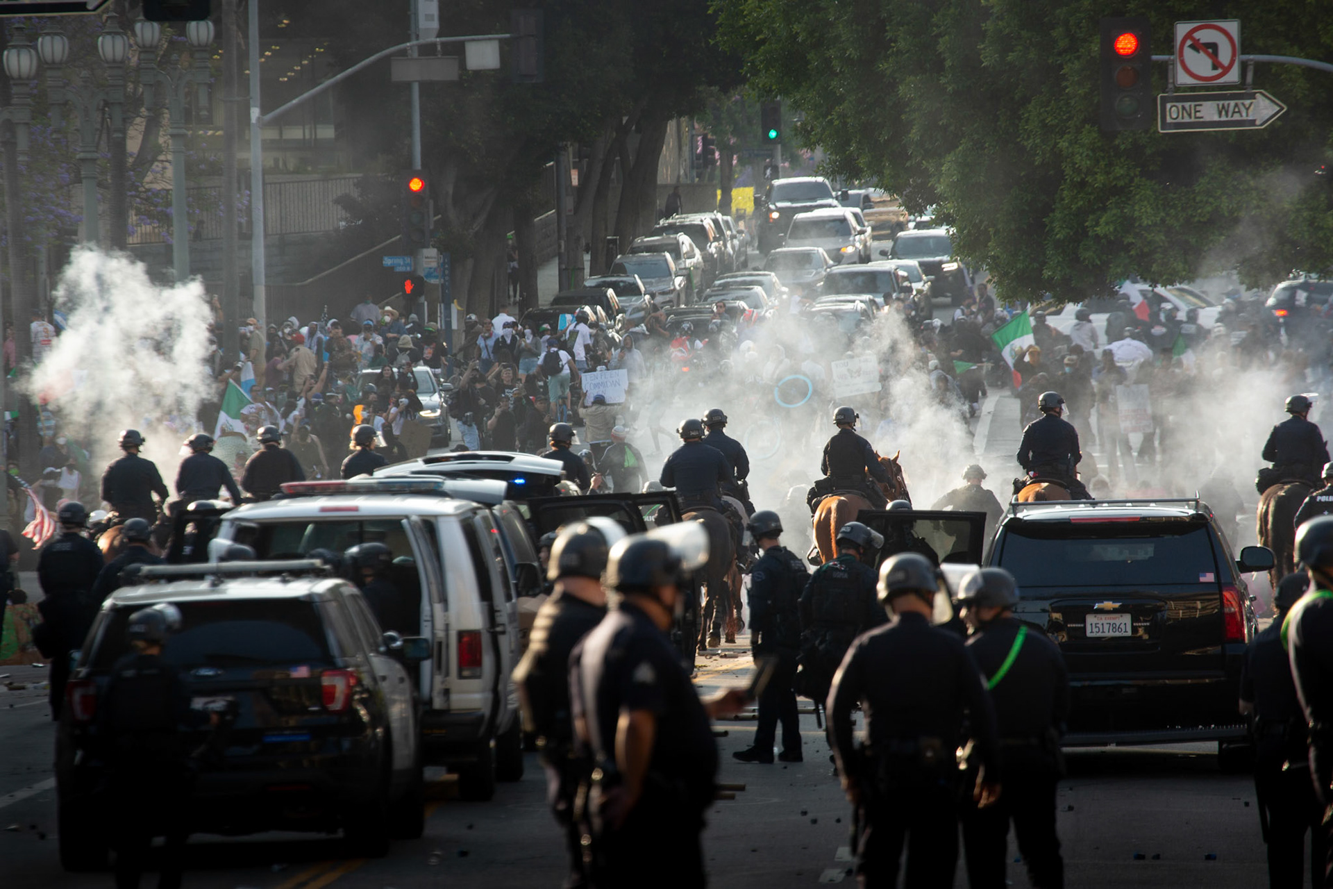 LAPD officers charge demonstrators on horseback while rubber bullets and tear gas is fired into the crowd in Donwtown Los Angeles, Calif. on June 8, 2025 during a protest against immigration raids conducted by ICE and Federal police.