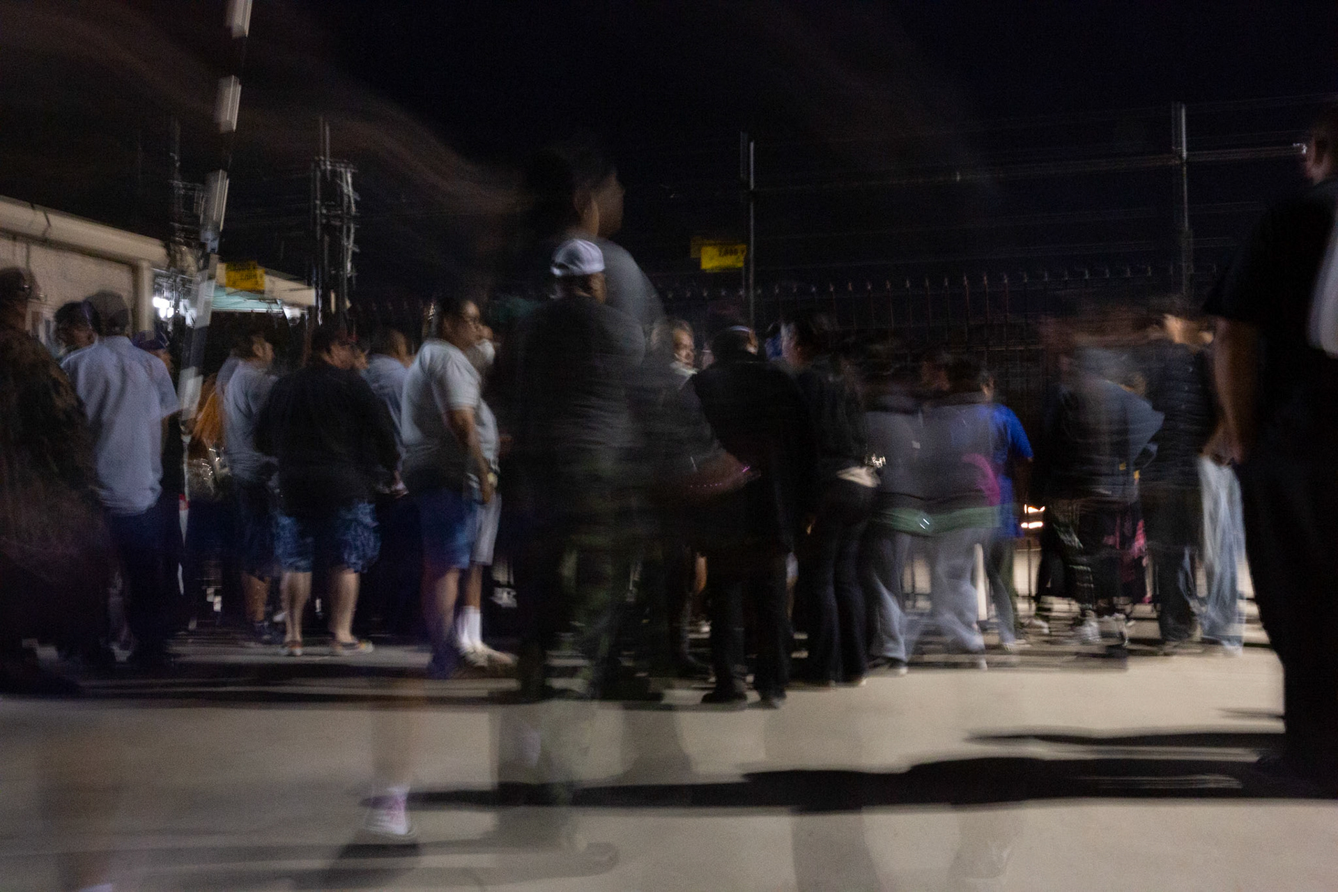 Families anxiously wait for their loved ones to come out of the farm facility after a mass immigraiton raid condicted by ICE and multiple DHs agencies in Camarillo, Calif. on July 10, 2025