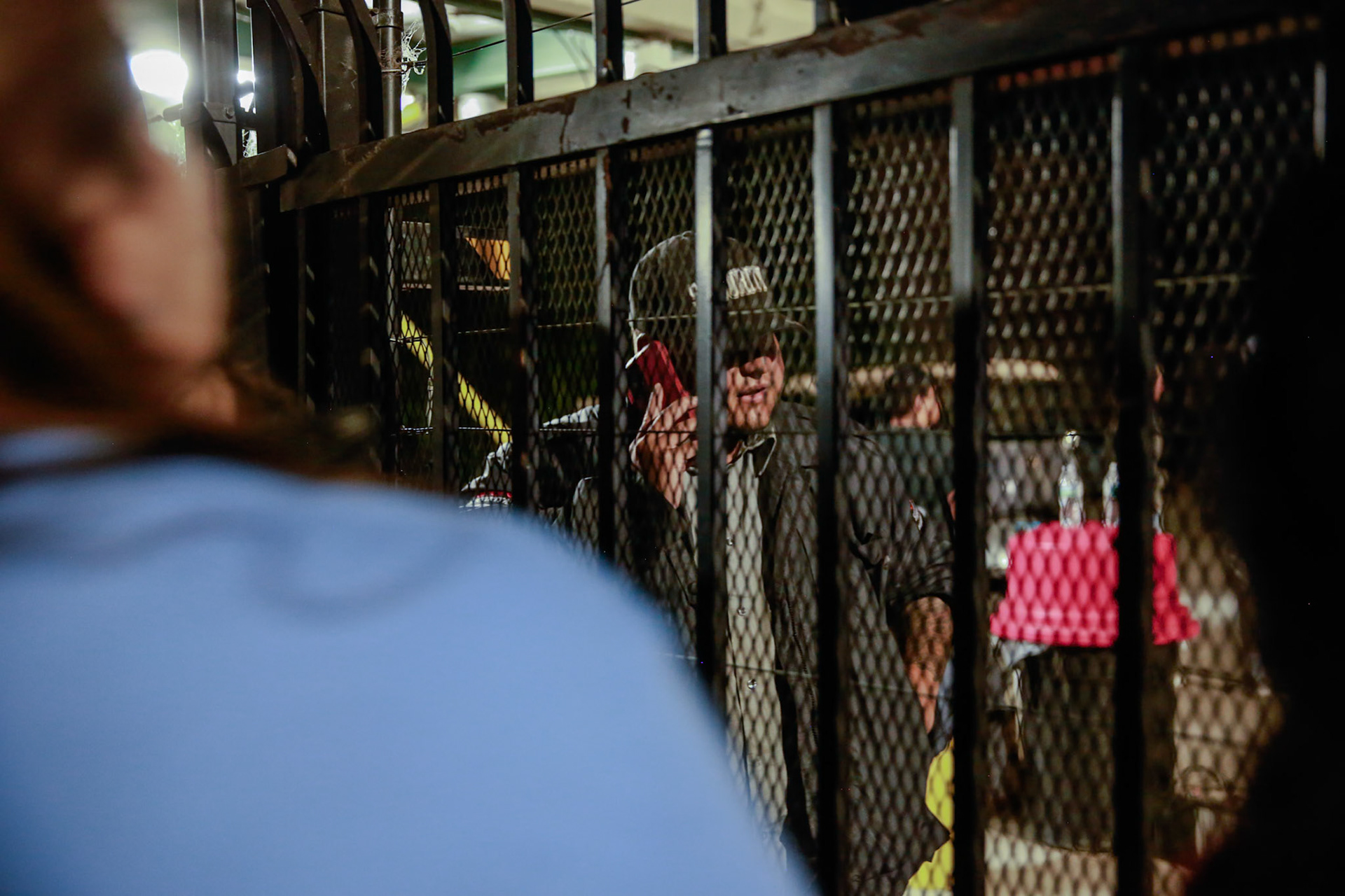 A farm worker coordinates with colleagues as workers who has been trapped inside the farm leaves the facility.  A mass immigraiton raid condicted by ICE and multiple DHs agencies in Camarillo, Calif. took place on July 10, 2025