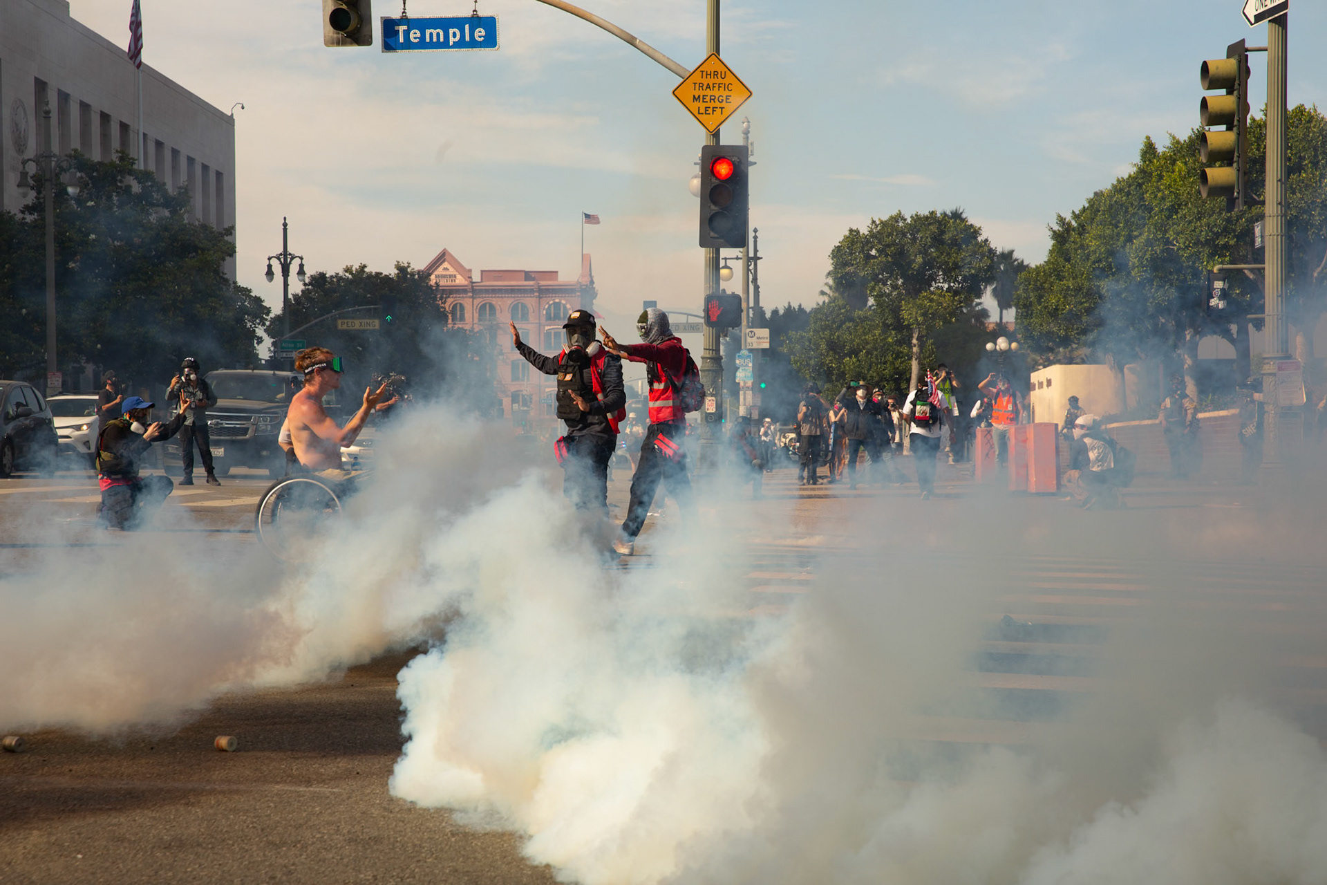 Los Angeles County Shriffs fires tear gas and flash bang grenades at peaceful demonstrators in a wheel chair during a march against the Trump Military Parade and immigration raids by ICE in Downtown Los Angeles on June 13, 2025