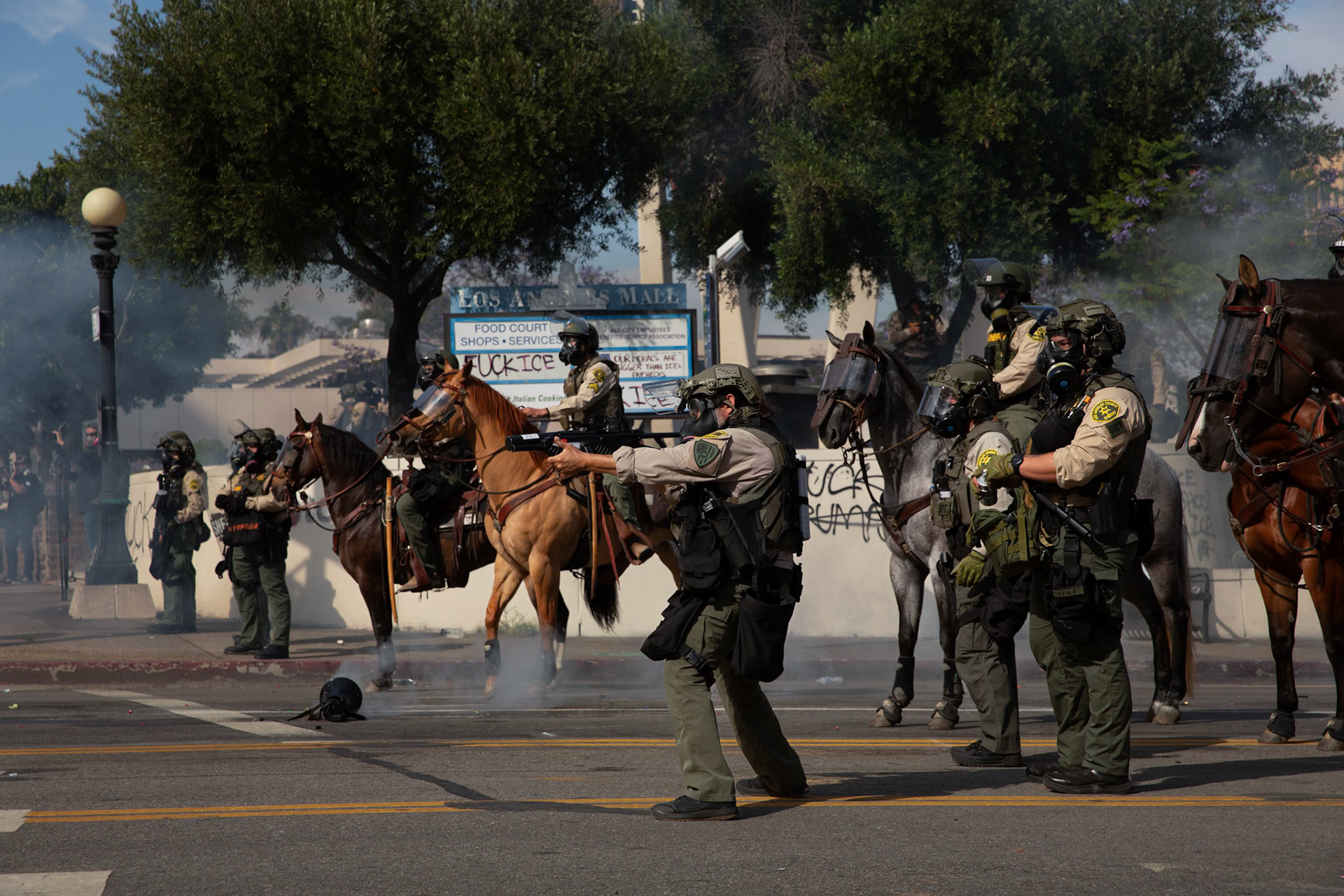 Los Angeles County Shriffs fires tear gas and flash bang grenades at peaceful demonstrators during a march against the Trump Military Parade and immigration raids by ICE in Downtown Los Angeles on June 13, 2025