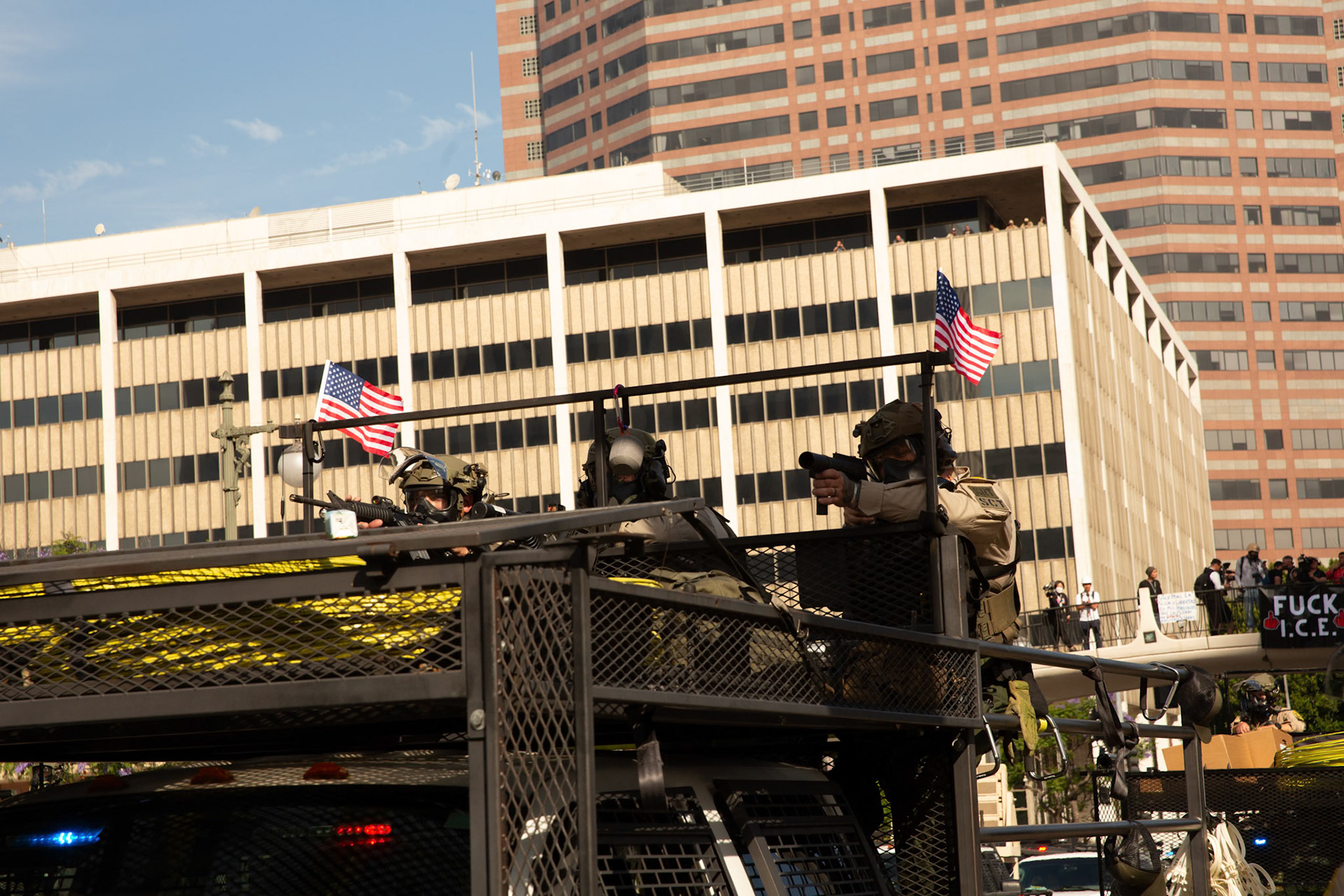 Los Angeles County Shriffs aims rifle, tear gas, and flash bang grenades at peaceful demonstrators during a march against the Trump Military Parade and immigration raids by ICE in Downtown Los Angeles on June 13, 2025