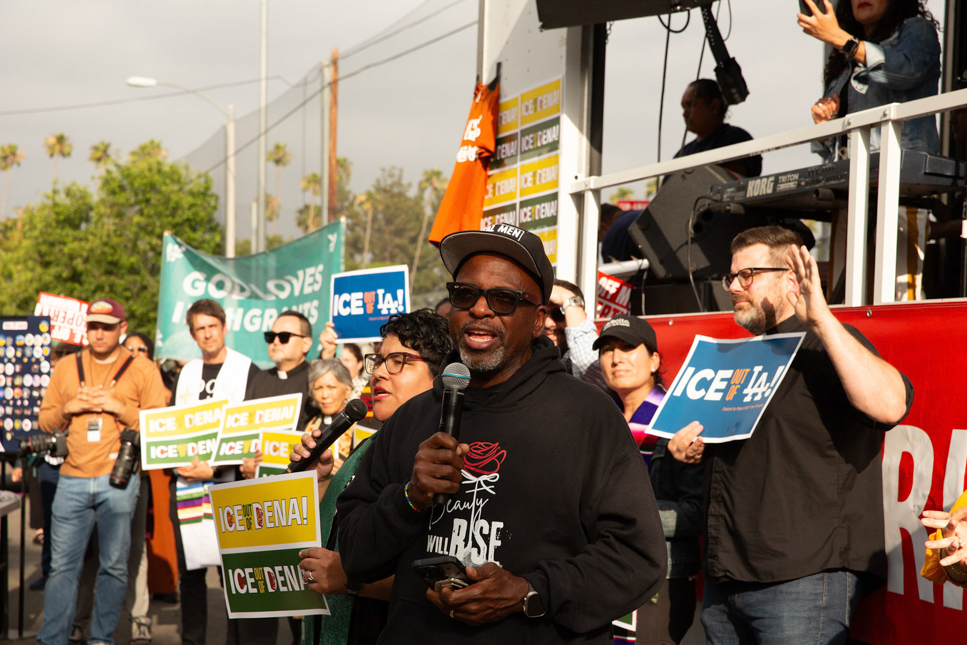 Pastor Kerwin Manning leads a player during a vigil held in honor of residents abducted by ICE in Pasadena, Calif. on June 21, 2025.