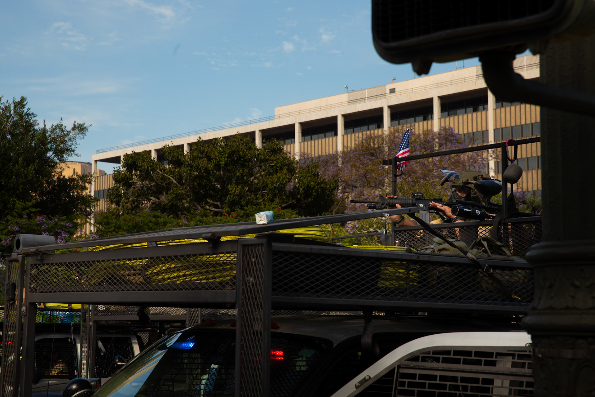 Los Angeles County Shriffs aims rifle at peaceful demonstrators during a march against the Trump Military Parade and immigration raids by ICE in Downtown Los Angeles on June 13, 2025