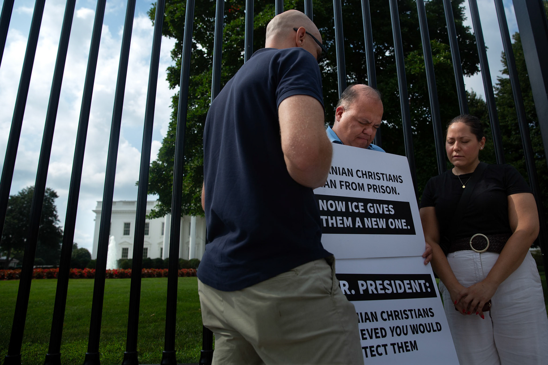 Washington, D.C. - Pastor Ara Torosian prays with visitors in front of the White House on July 22, 2025 asking for the release of Iranian asylum seekers held by ICE.