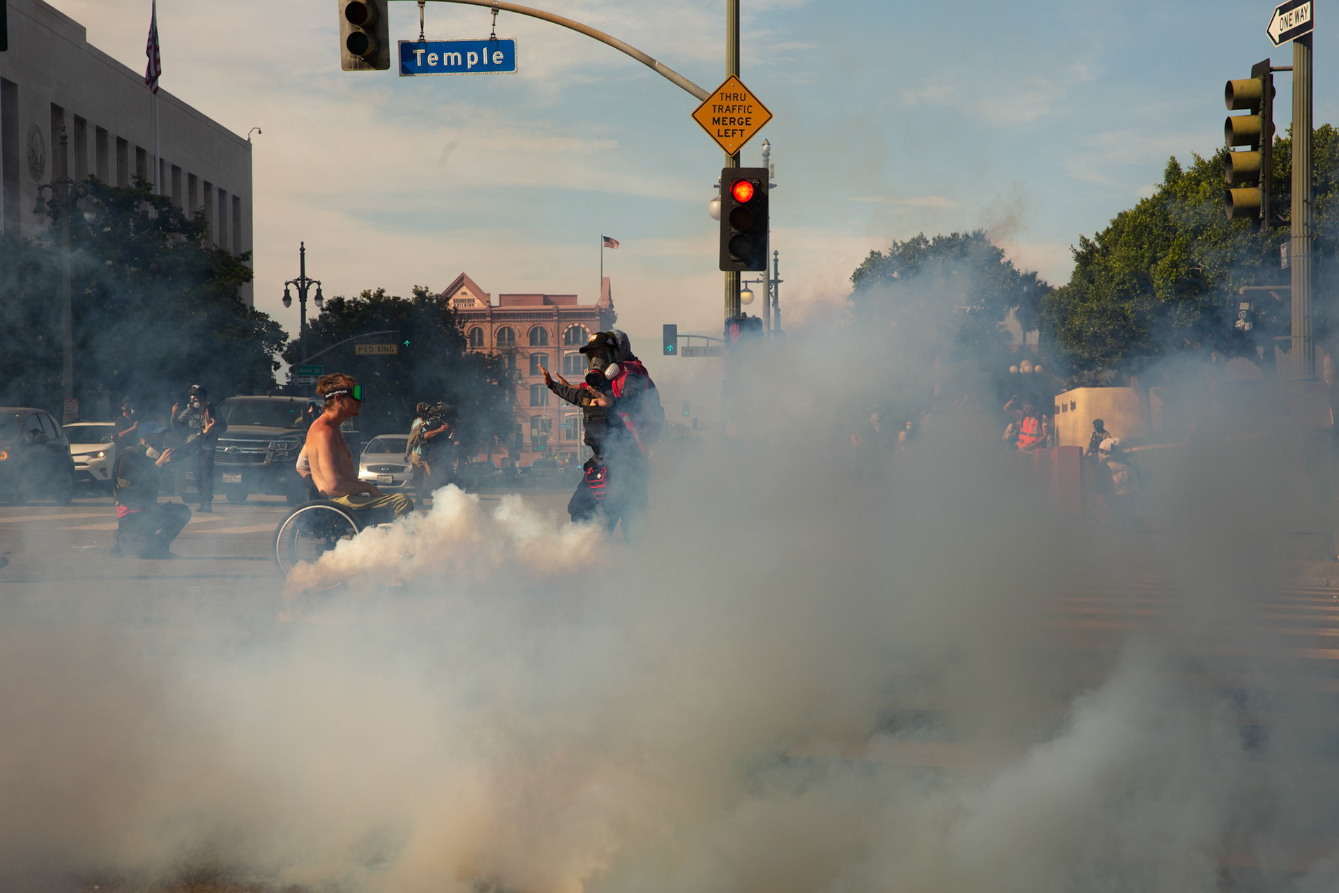 Los Angeles County Shriffs fires tear gas and flash bang grenades at peaceful demonstrators in a wheel chair during a march against the Trump Military Parade and immigration raids by ICE in Downtown Los Angeles on June 13, 2025