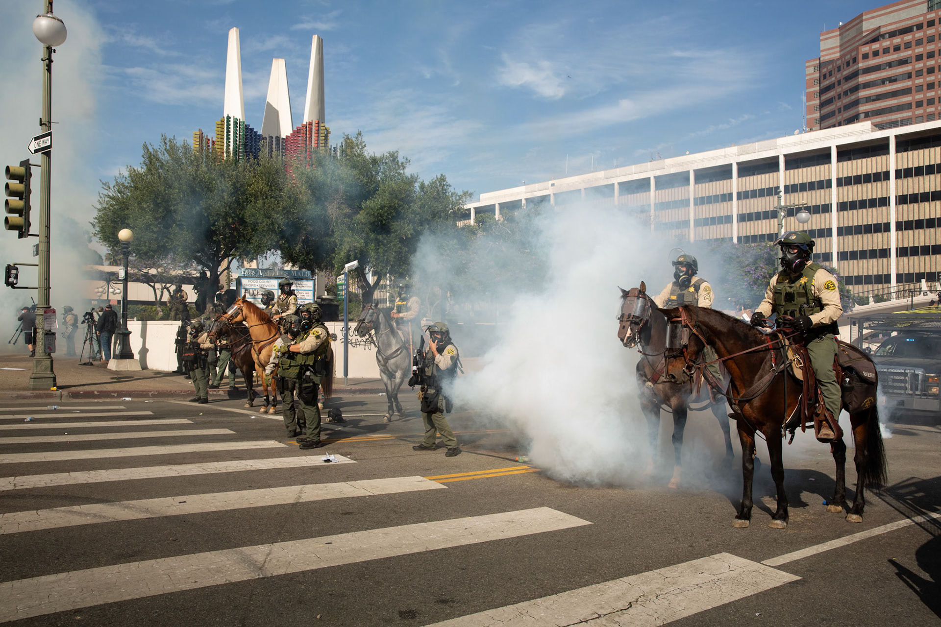 Los Angeles County Shriffs fires tear gas and flash bang grenades at peaceful demonstrators during a march against the Trump Military Parade and immigration raids by ICE in Downtown Los Angeles on June 13, 2025