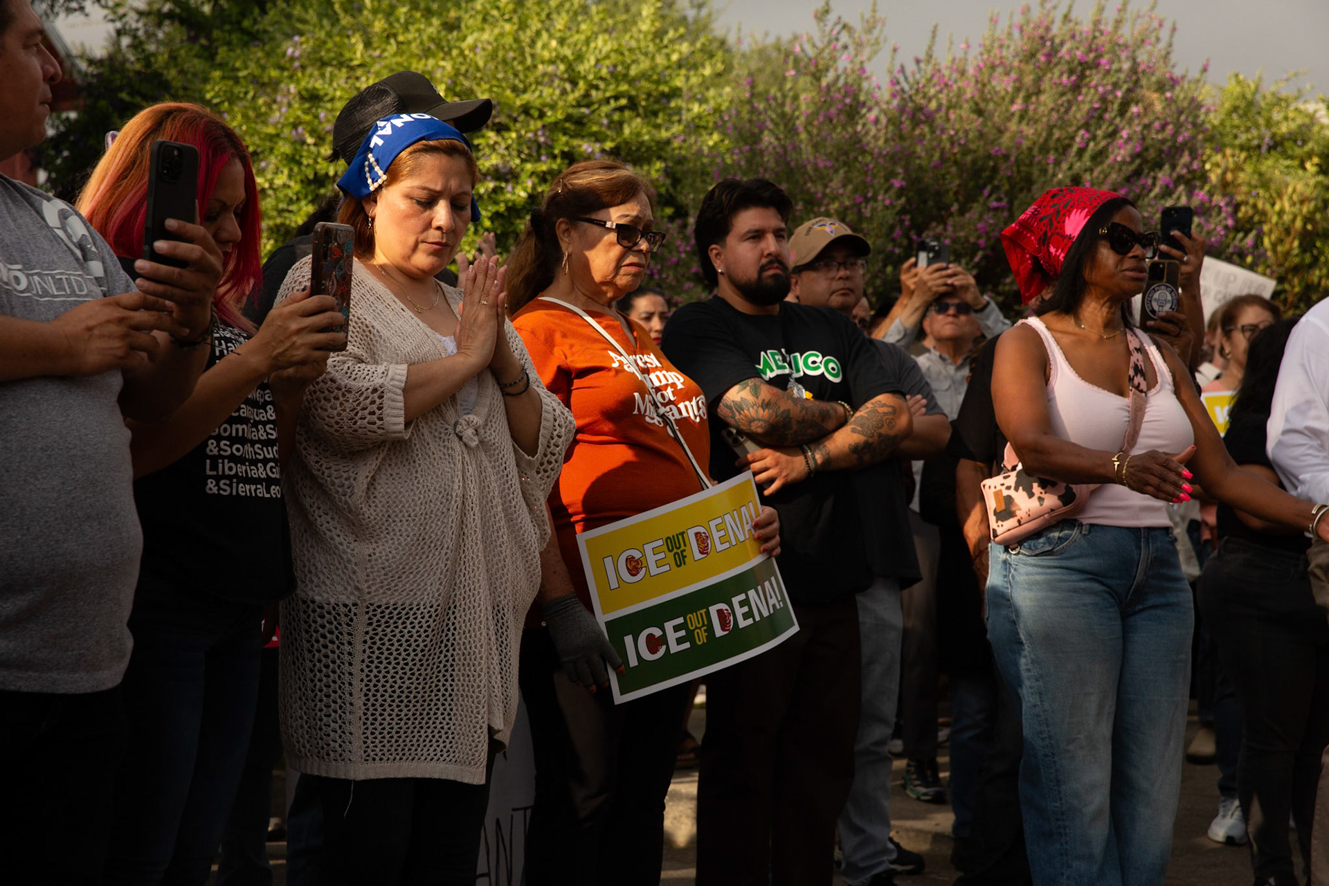 Citizens pray asPastor Kerwin Manning leads a player during a vigil held in honor of residents abducted by ICE in Pasadena, Calif. on June 21, 2025.