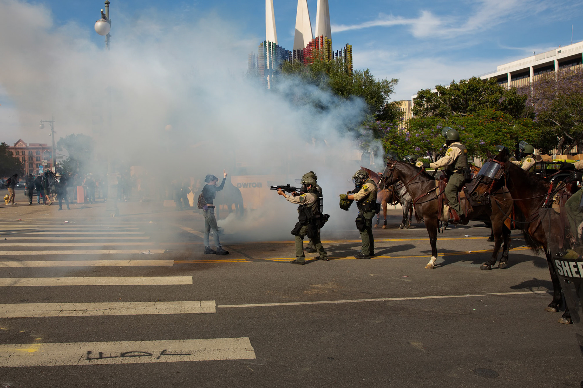 Los Angeles County Shriffs fires tear gas and flash bang grenades at peaceful demonstrators during a march against the Trump Military Parade and immigration raids by ICE in Downtown Los Angeles on June 13, 2025