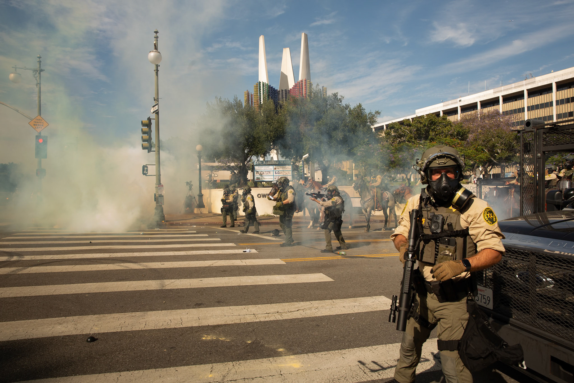 Los Angeles County Shriffs fires tear gas and flash bang grenades at peaceful demonstrators during a march against the Trump Military Parade and immigration raids by ICE in Downtown Los Angeles on June 13, 2025