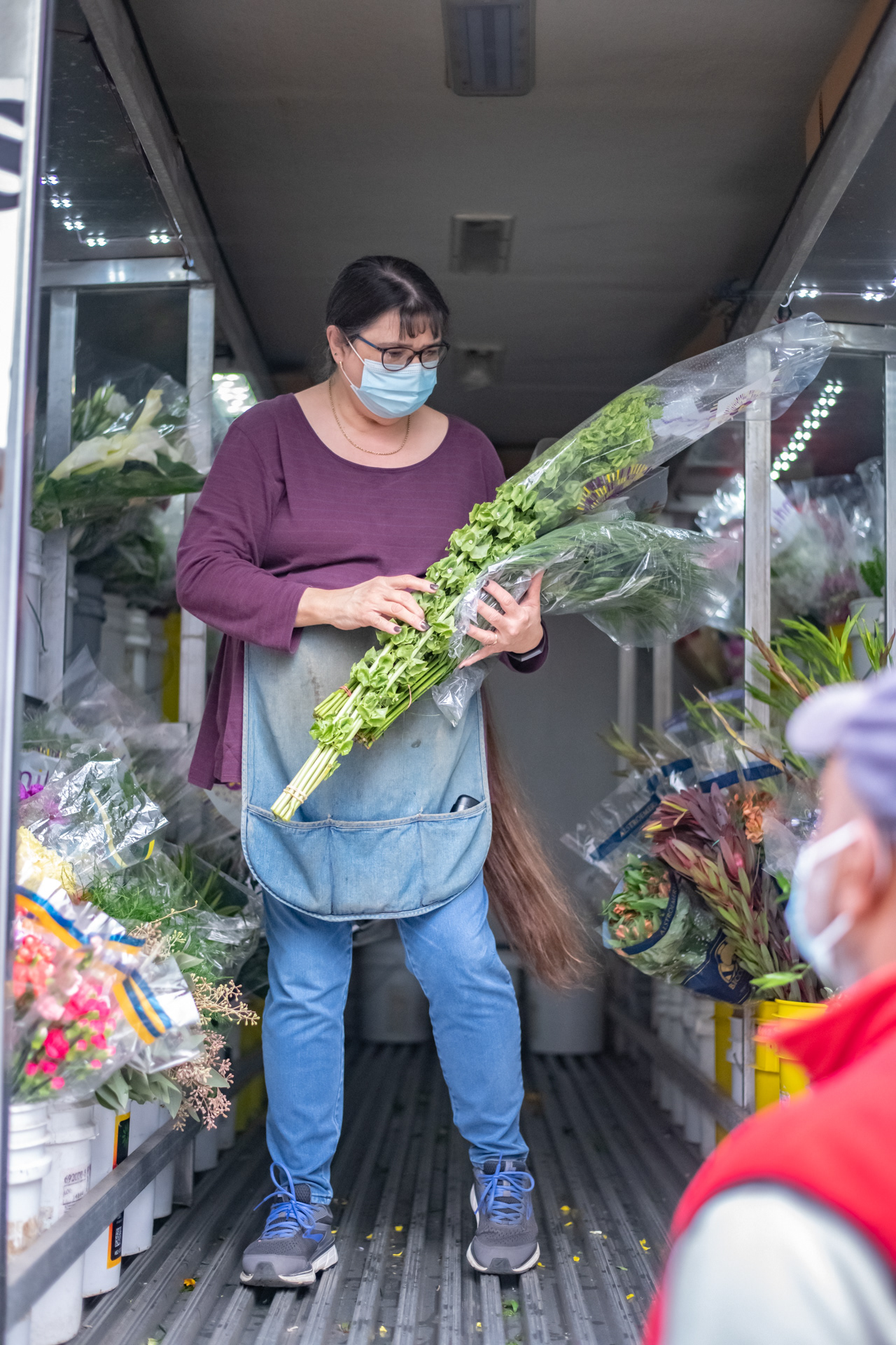 Becky Bevan picks out new flowers from the truck that comes to her florist every week at Always In Bloom Florist in Archdale, N.C. on November 25, 2020.