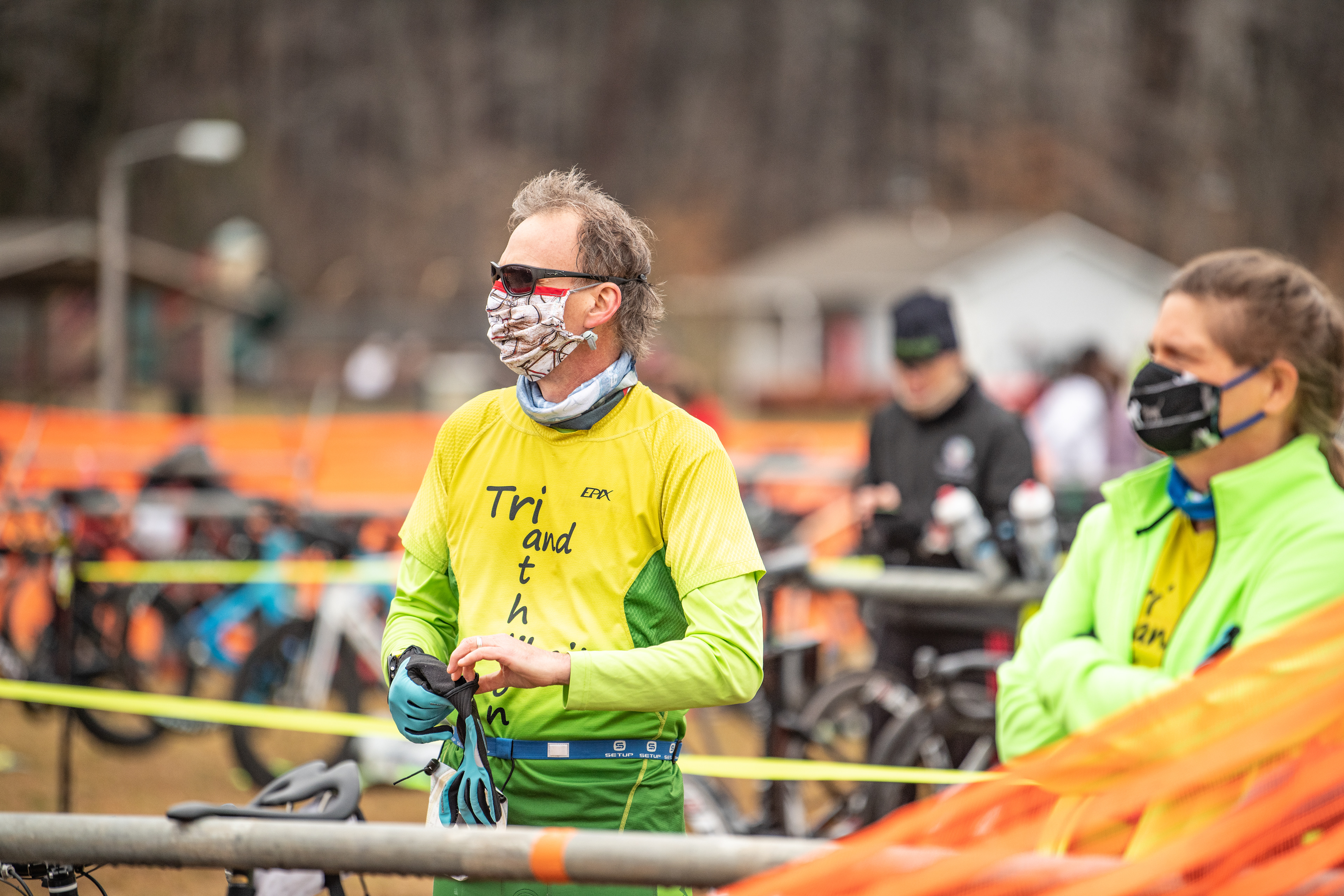 Steven Heller puts on his gloves while listening to announcments before the Northeast Park Duathlon in Gibsonville, N.C. on February 27, 2021.