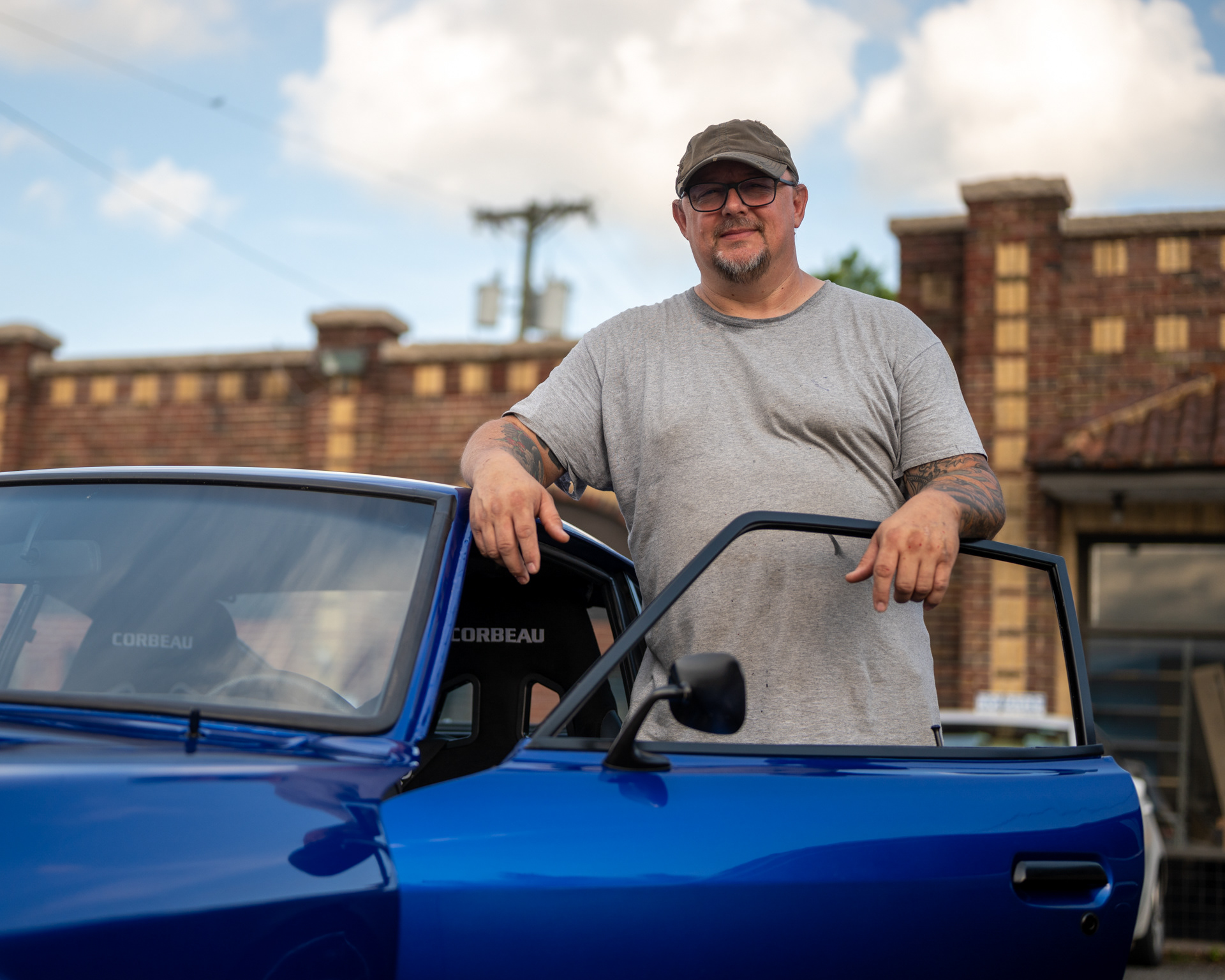 Robert Marshall stands beside his Datsun 240Z that he restored himself at the Uptown Lexington Cruise In in Lexington, N.C. on June 8, 2021.