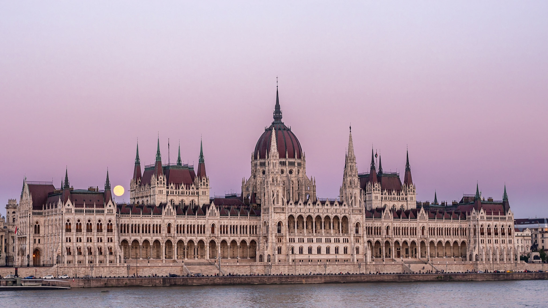 Moon making initial appearance over the Hungarian Parliament