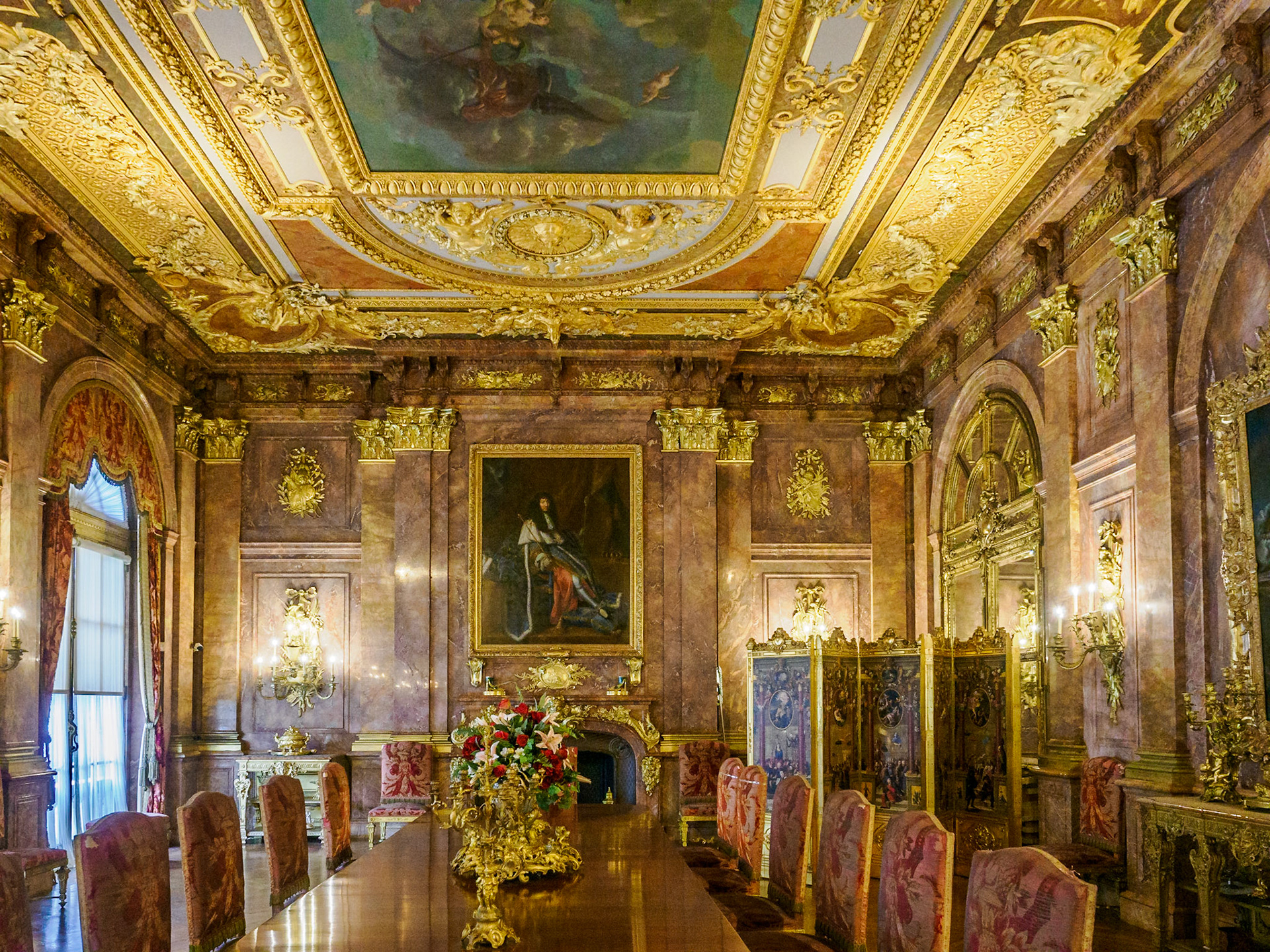 The walls of the dining room were covered in rose-colored marble from Algeria. The chairs were made of bronze covered in gold. Each weighed 75 pounds.