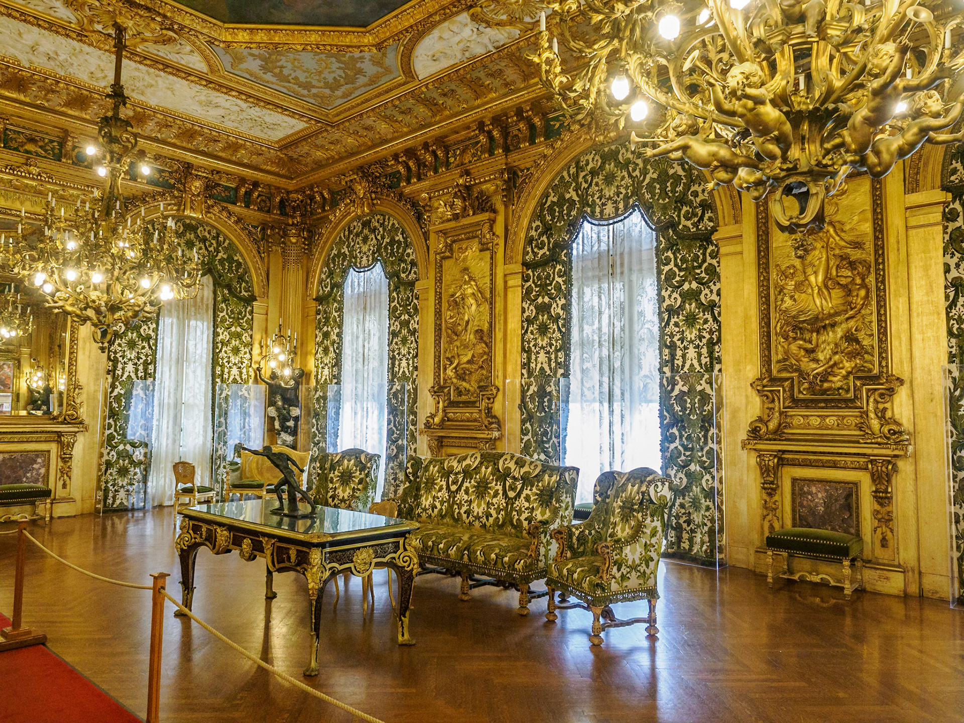 The Grand Salon is entirely covered in 22-carat gold. In 1895, at a time when the rest of Newport was lit by flickering gaslights, the Marble House was ablaze in electric lights.
