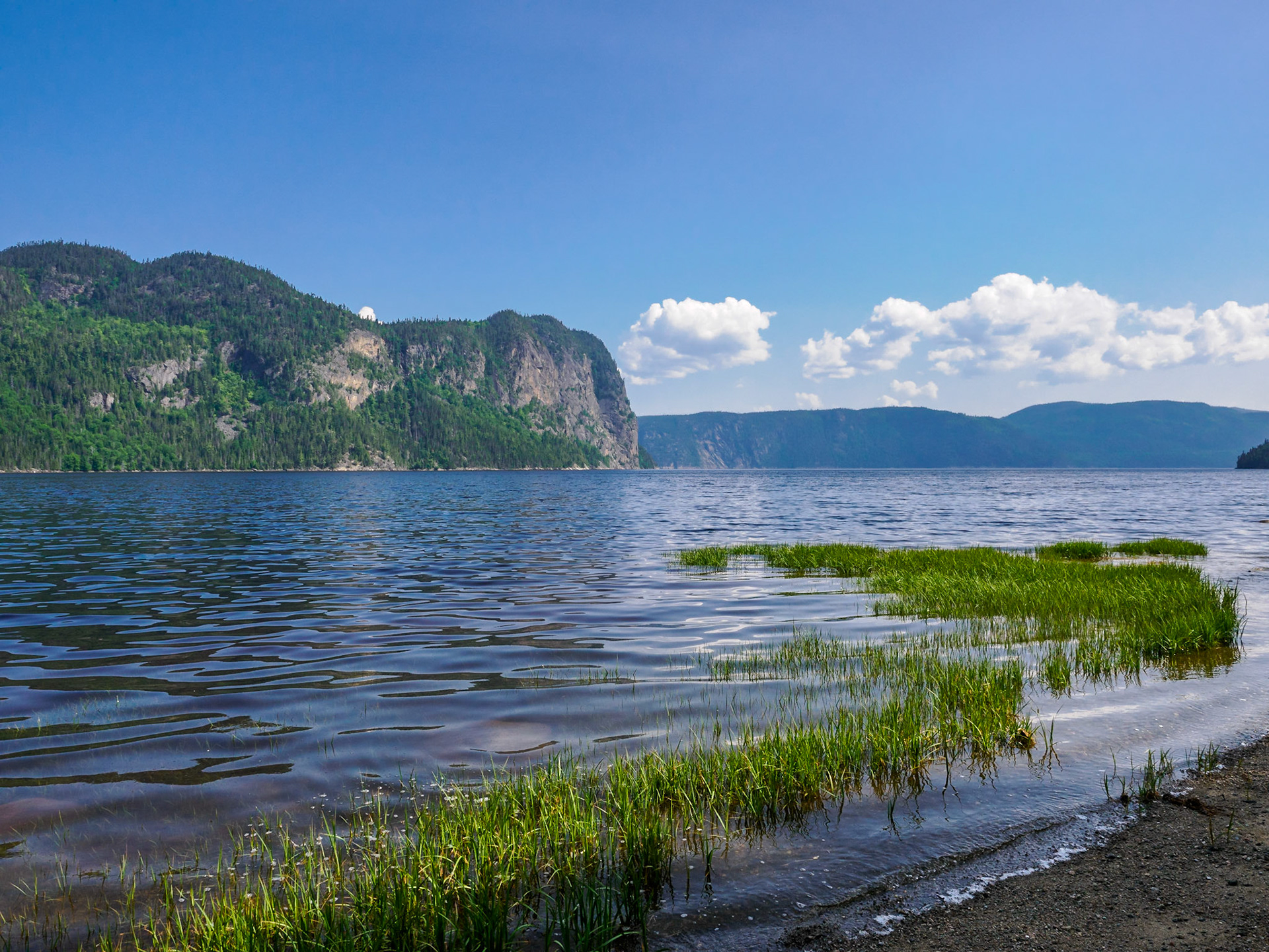 The shore of Eternity Bay with the Saguenay River in the background.