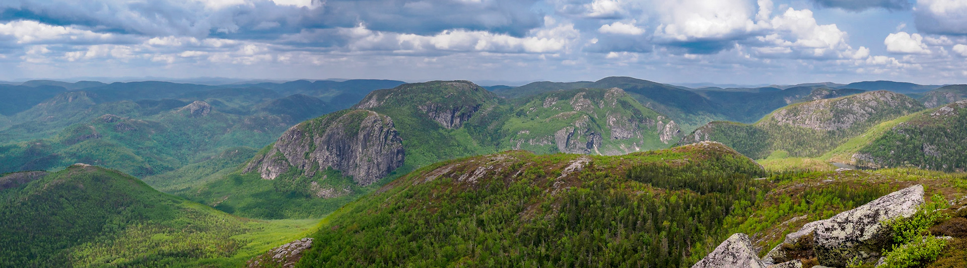 Clouds started forming to the west as we got near the peak. This panorama shows other mountains in the Laurentian range.