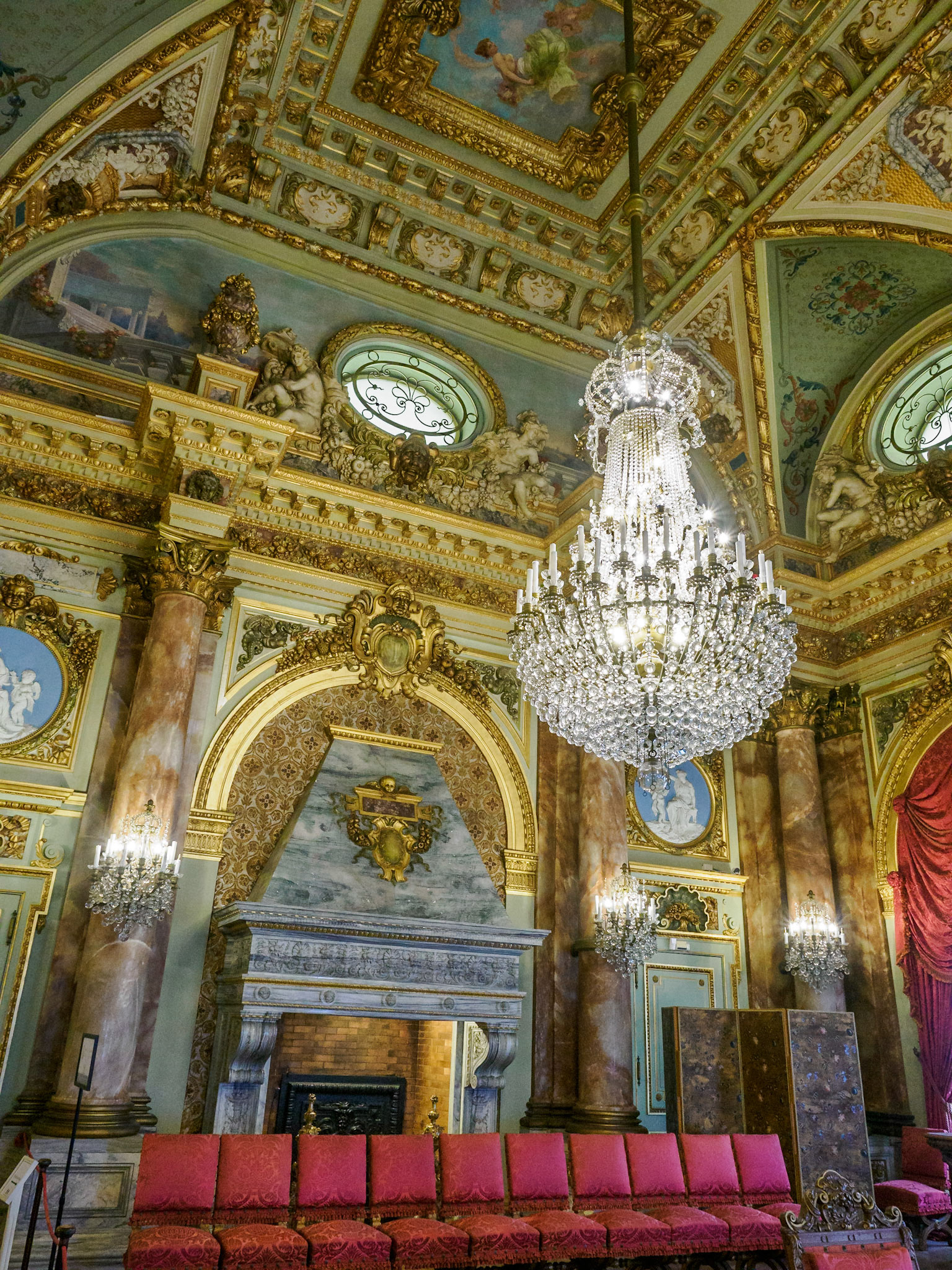 In the dining room, the massive twin chandeliers (like the one shown here) and 12 wall sconces sparkle with Baccarat crystal.