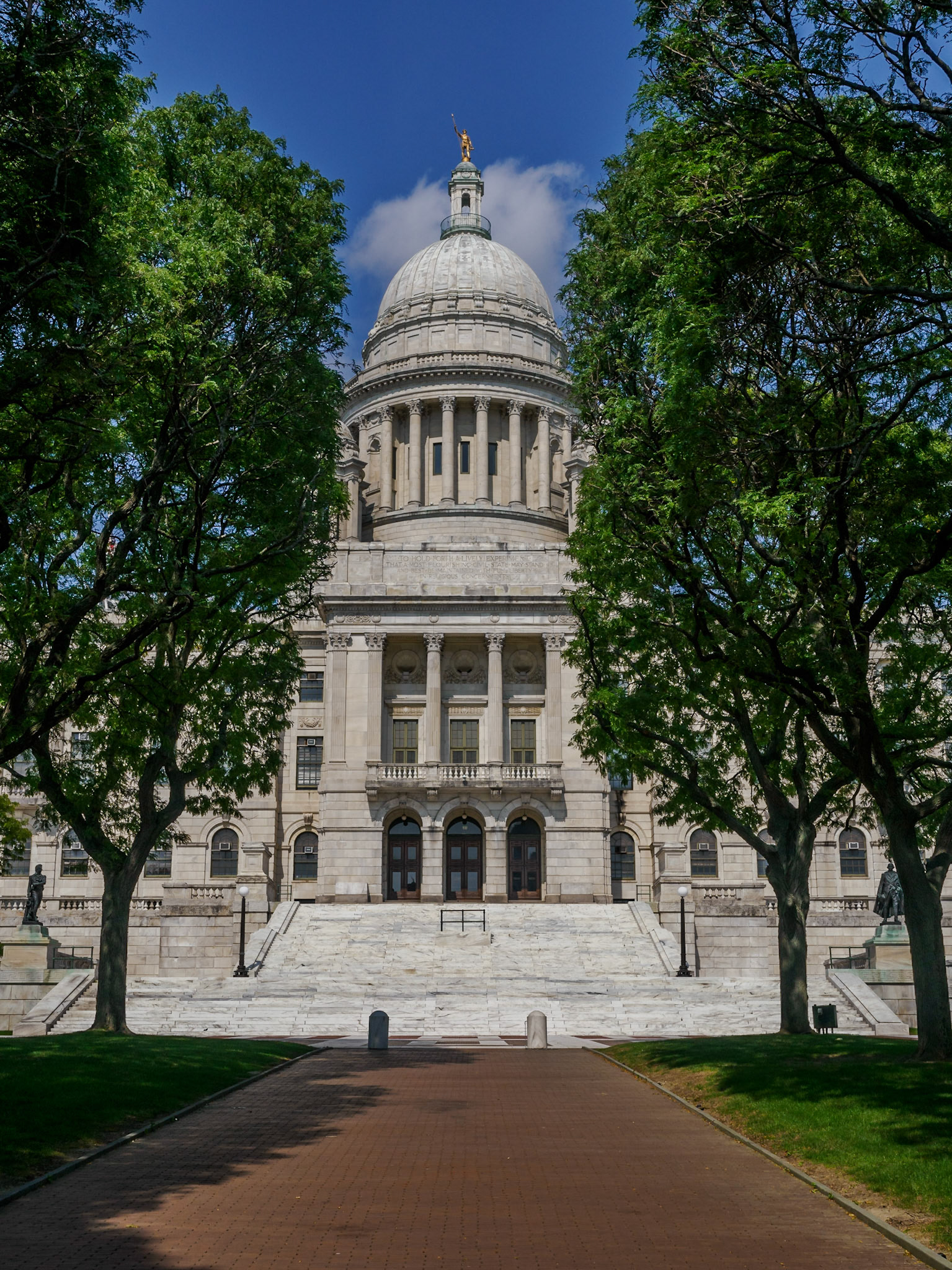 The majestic domed State House, clad in white Georgia marble, was built (1895-1904) at the high point of Rhode Island's industrial prosperity. Inside is the Colonial Charter granted in 1663 by King Charles II of England. The Charter was the first signed by a monarch to guarantee religious liberty. Atop the State House dome stands a statue of Rhode Island's Independent Man, representing the spirit of freedom of thought and action.