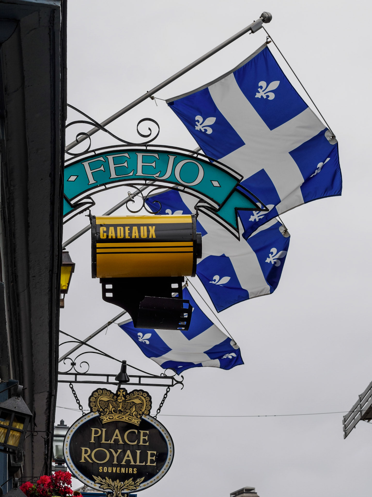 The flag of Quebec with its four white fleurs-de-lis (lily flower)
