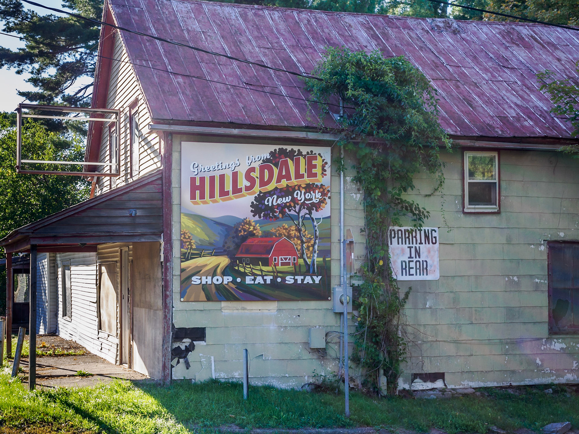 How could we not stop for an old-time Americana roadside sign on the side of a building? It didn't look like there had been any shopping, eating, or staying at this building in a while though.