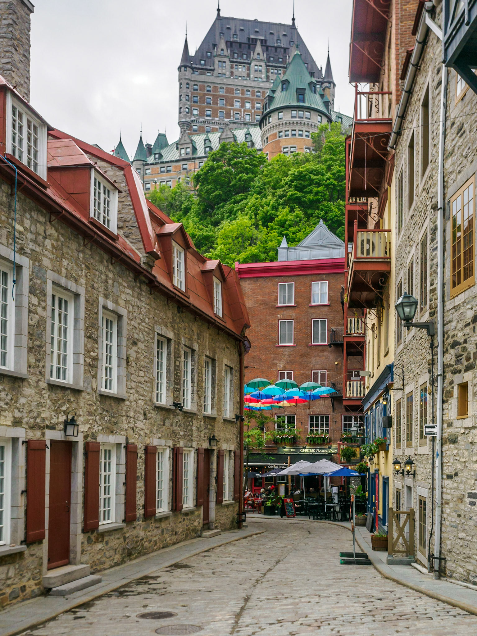 This is Rue du Cul-de-Sac, a street made famous by the colorful umbrellas hanging above it. It also has a view of the Château Frontenac overhead.