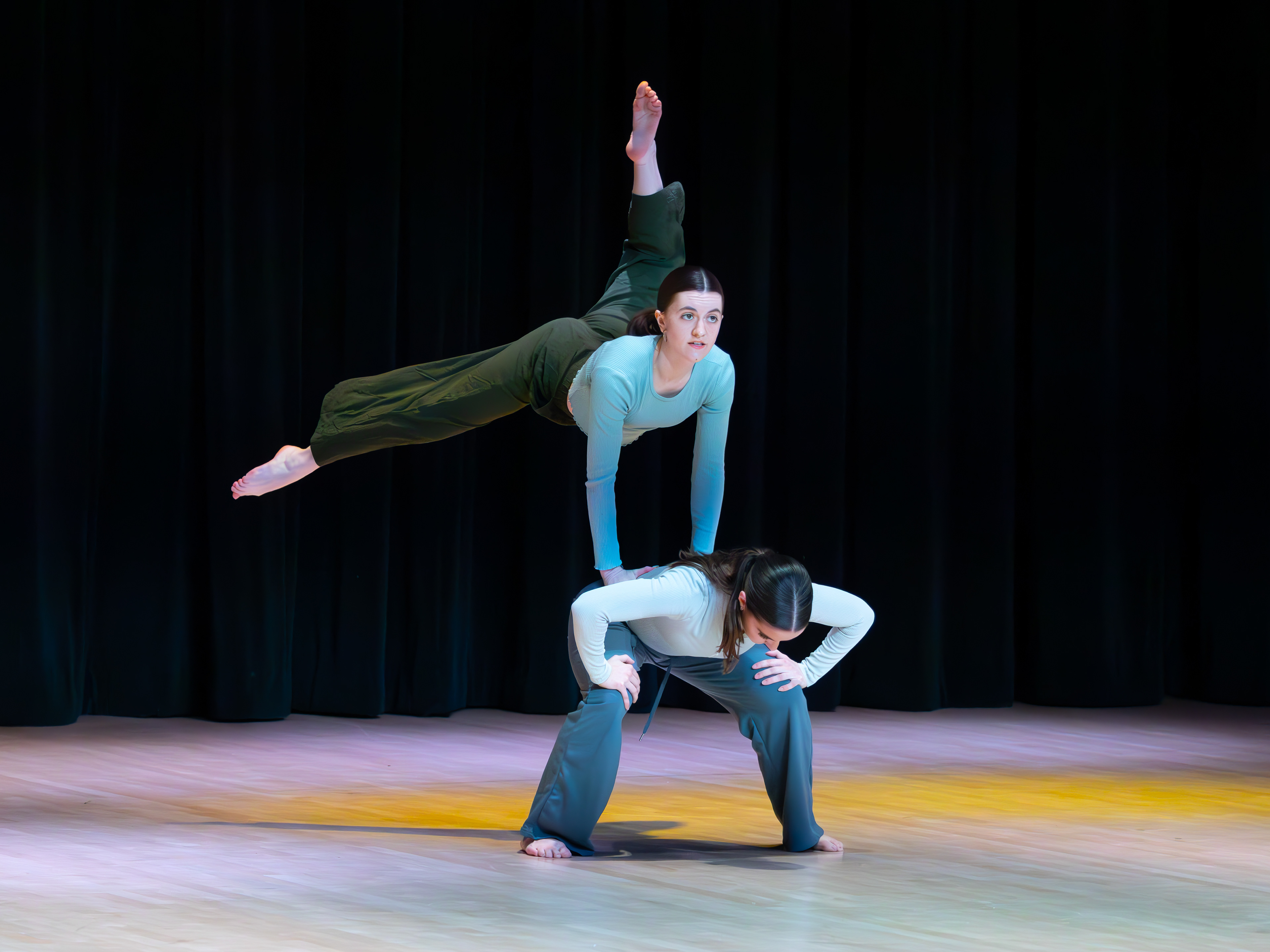 Allison Wilson (flying), Sarah Becker (base) are performing an acrobatic duet. (Jackie Mitchell/JMC 4114)