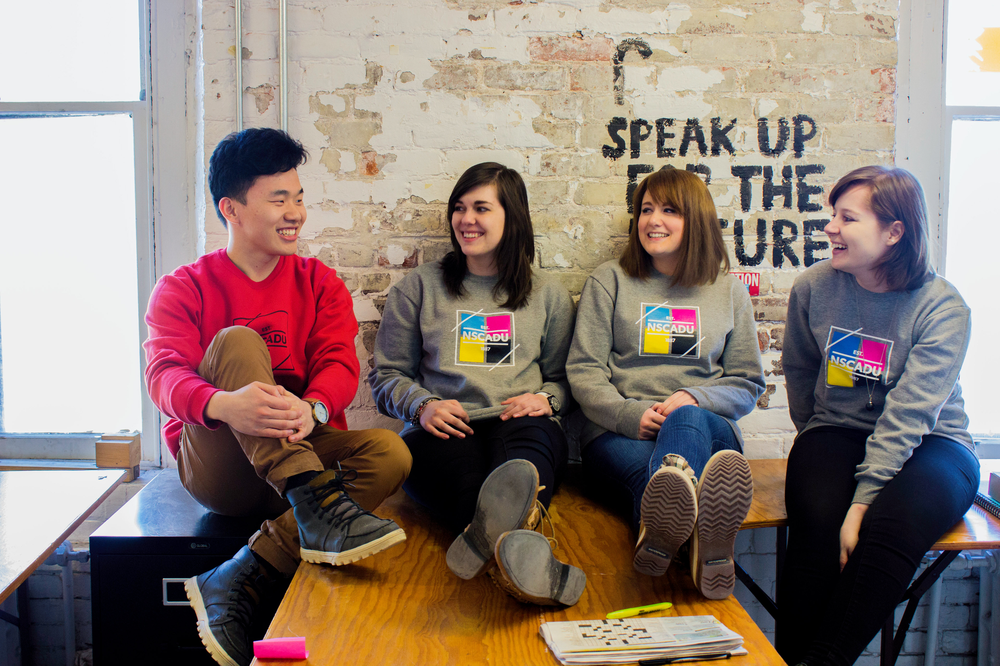NSCAD University students sporting the school clothing line, NSCAD Apparel in the design studio