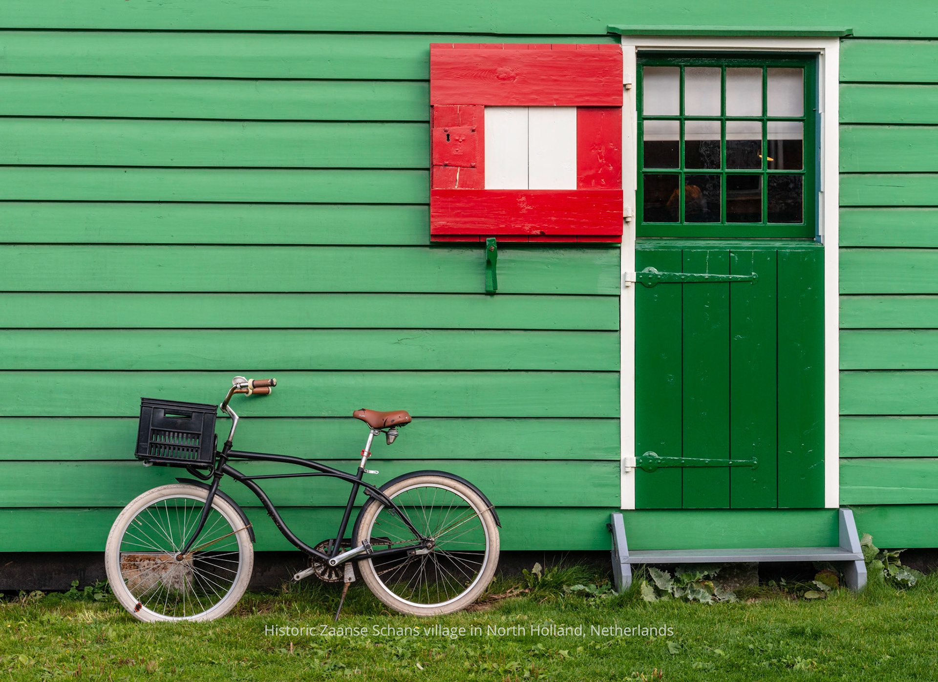 Bicycle leans against the bakery building in the historic village of Zaanse Schans in North Holland, Netherlands
