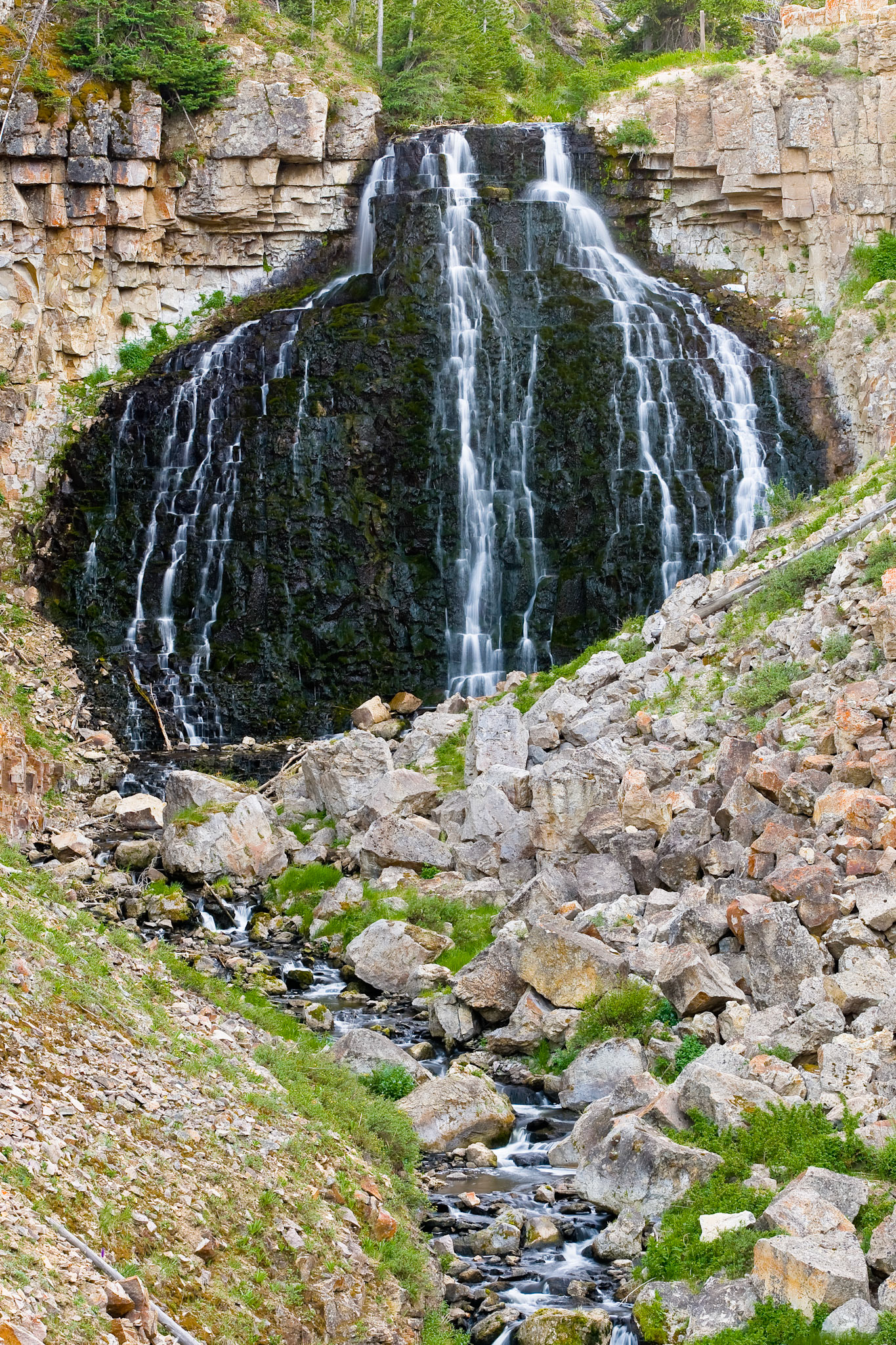 Water trickles over the face of Rustic Falls in Yellowstone National Park.