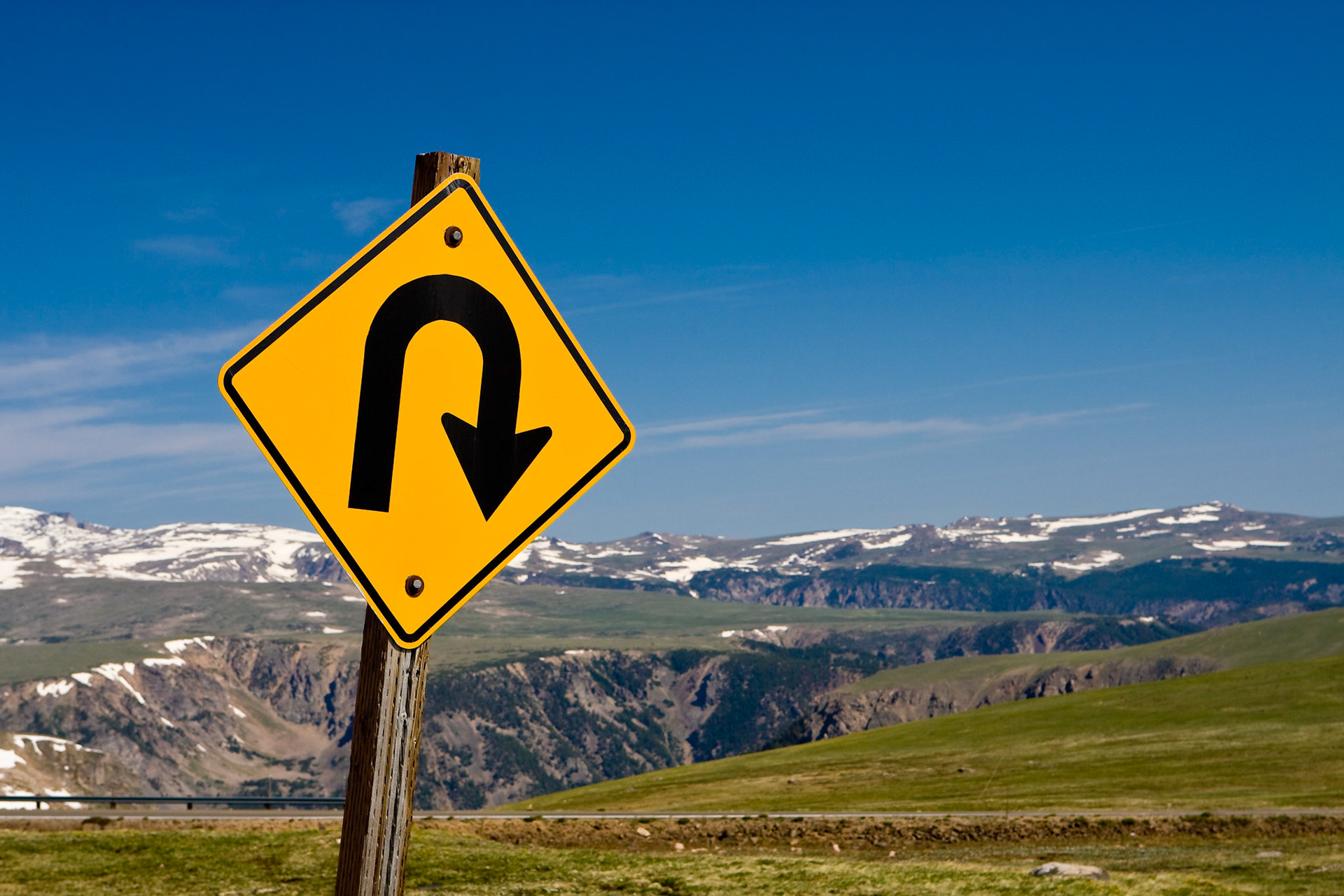 A road sign on the Beartooth Scenic Highway understates the frequent sharp corners the road follows.