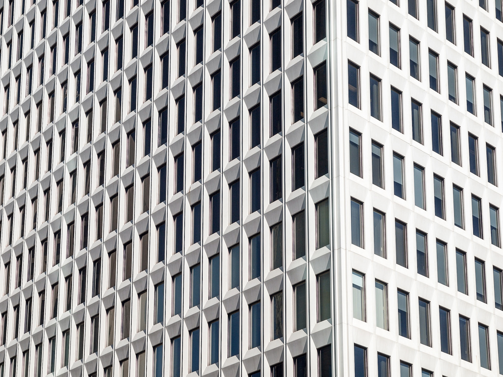 Angualr view of an office tower window pattern in The Exchange District, Winnipeg, Manitoba, Canada