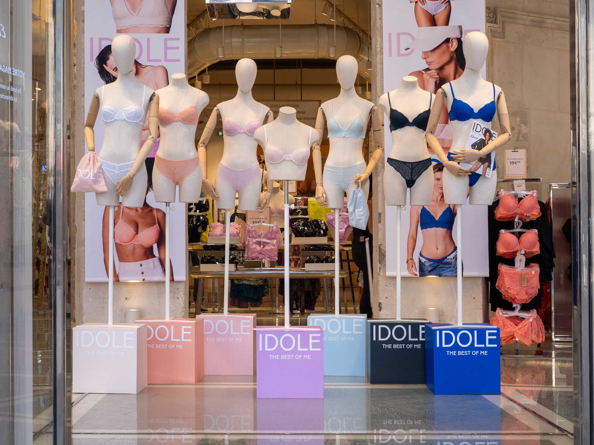 Seven partial mannequins display various colours of lingerie in a store in Paris, france