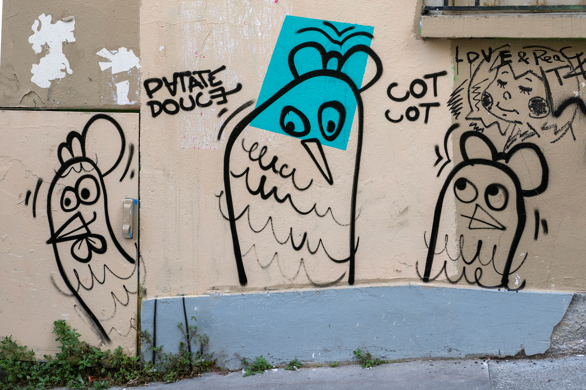 Three characature chickens drown in black outline adorn a brige wall with pealing paint along a street in Montmartre, Paris