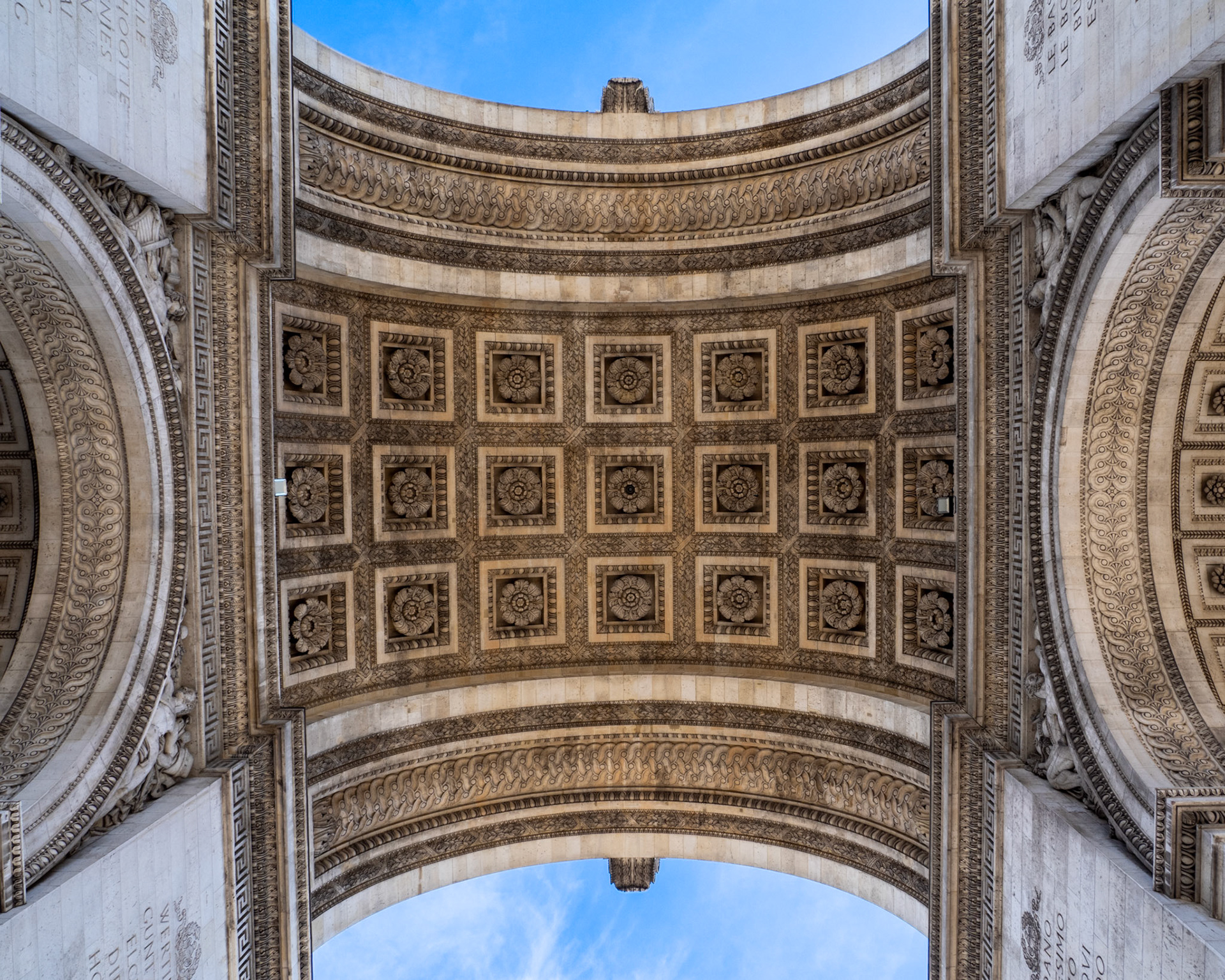 The patterns and designs created in the curving underside of the Arc de Triomphe
