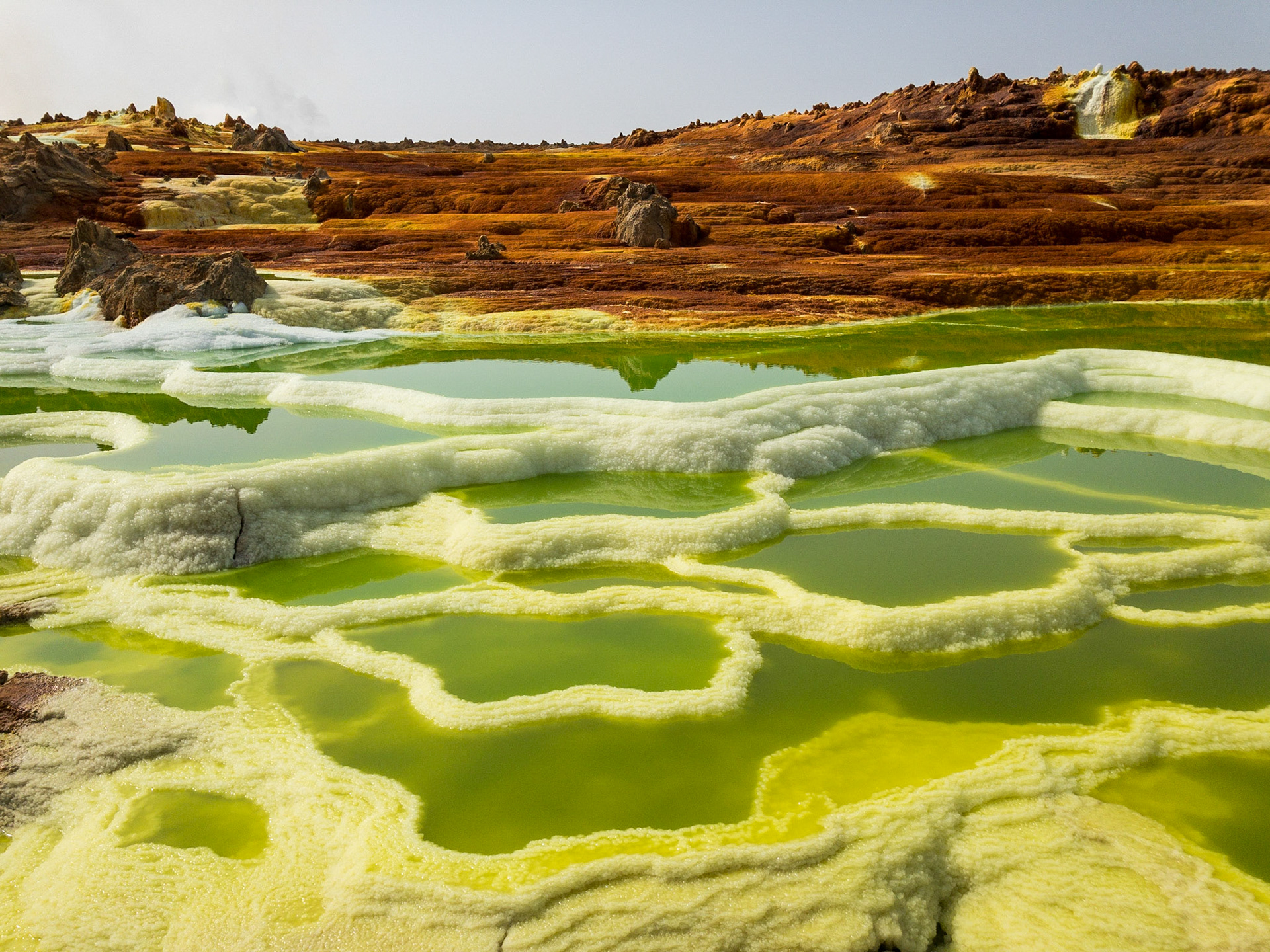 Green and yellow pools of saline, sulphuric acid, formed from hydrogen thermal activity at Dallol in Ethiopia’s Danakil Depression, the hottest, driest, most inhospitable place on Earth.