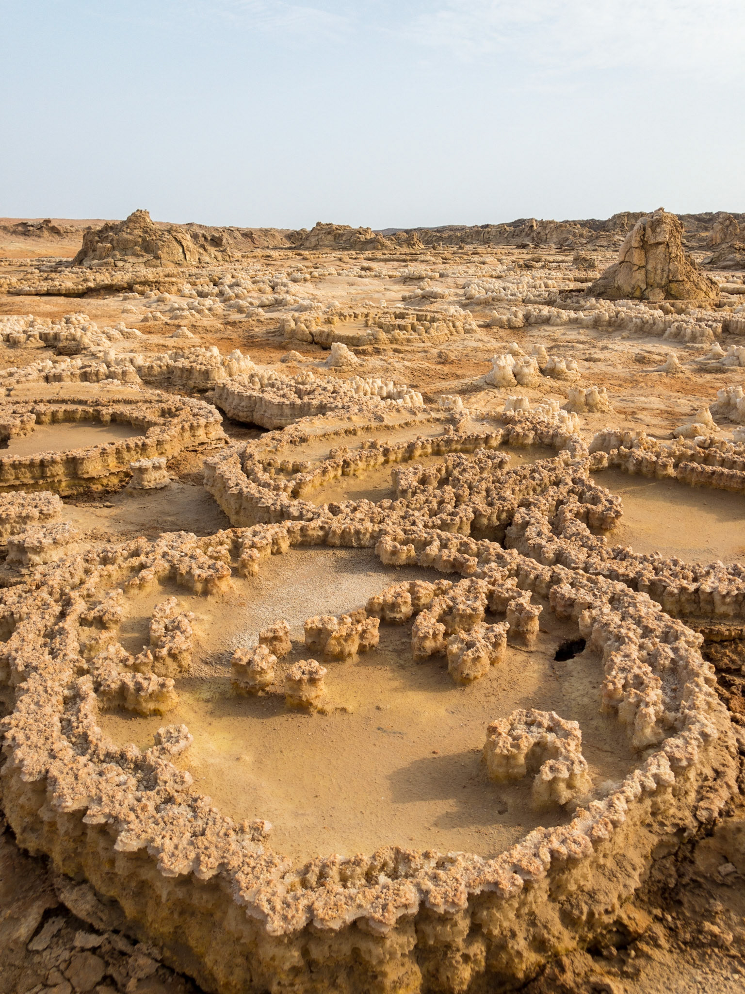 Circular patterns of dried salt stretch across the desolate Asale landscape in Ethiopia’s Danakil Depression, the hottest, driest, most inhospitable place on Earth.